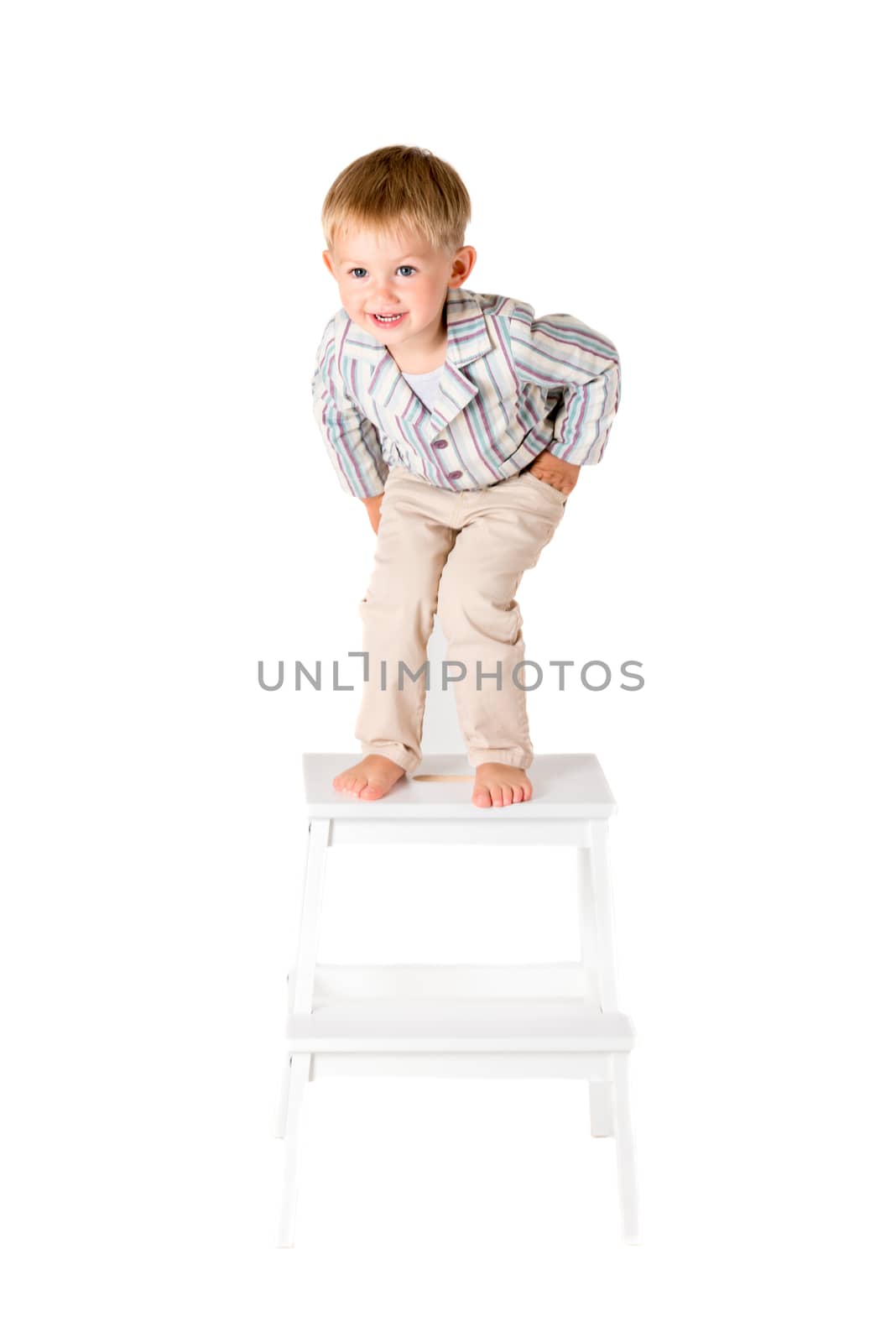 Boy shot in the studio on a white background bended over by Nanisimova