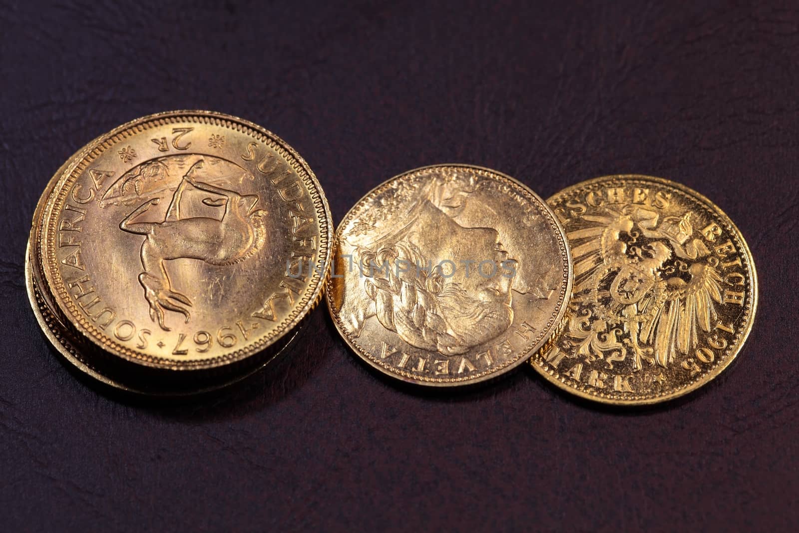 Old gold coins on a dark background