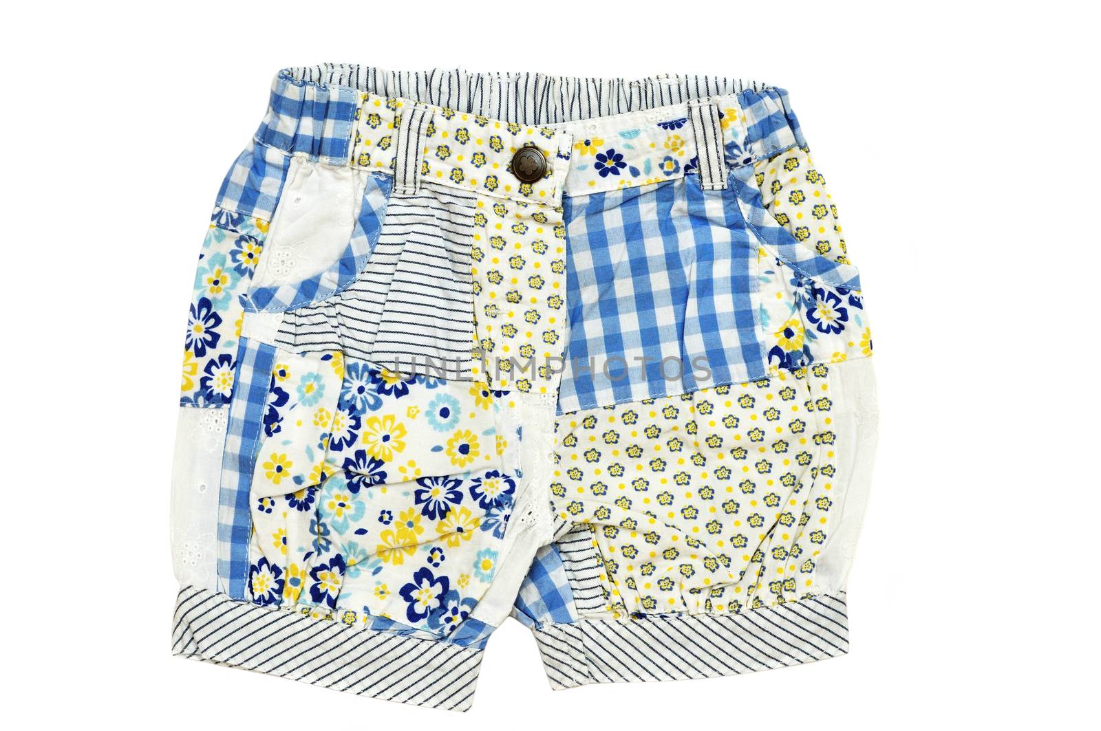 baby girl's shorts on over the white background