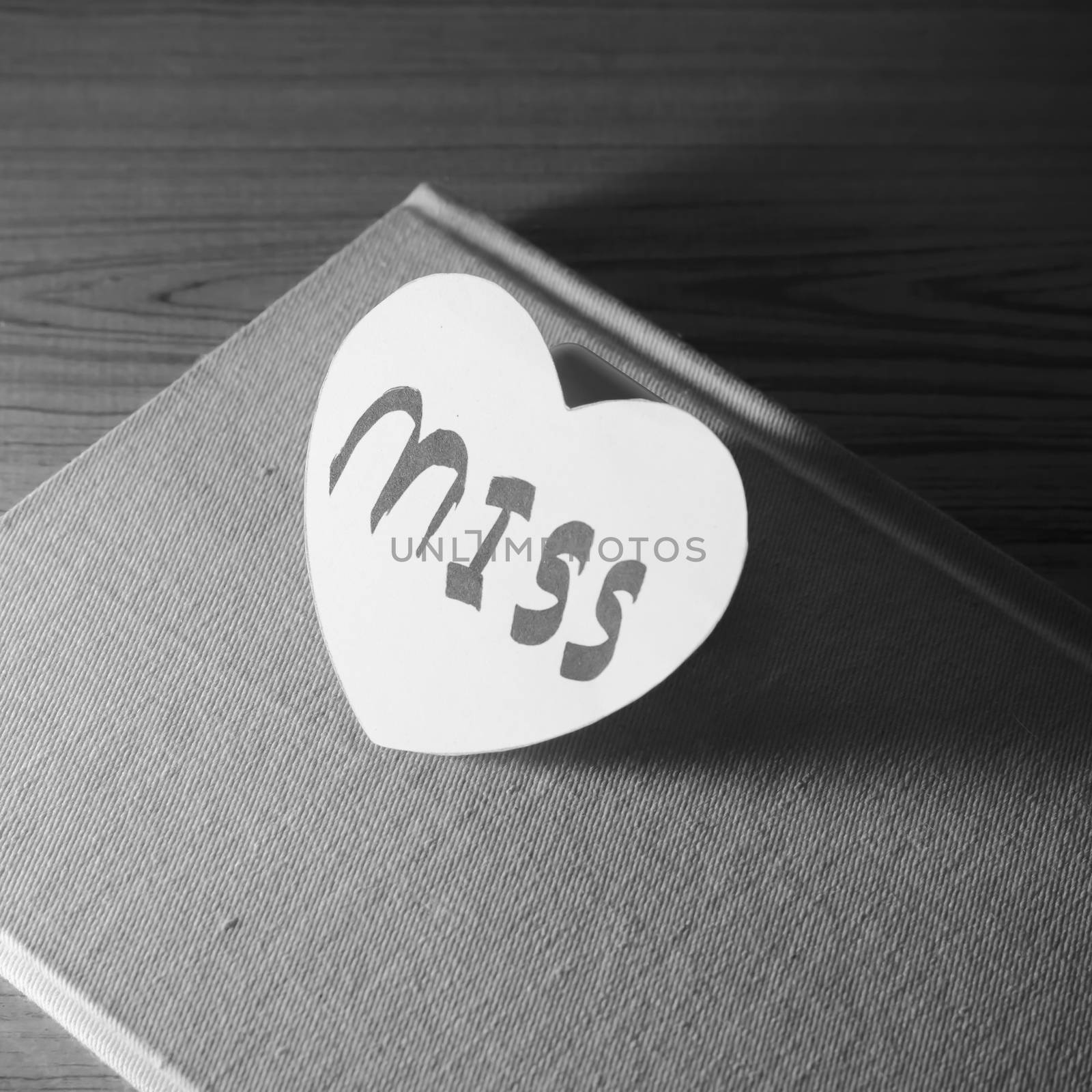 black and white paper heart write miss word