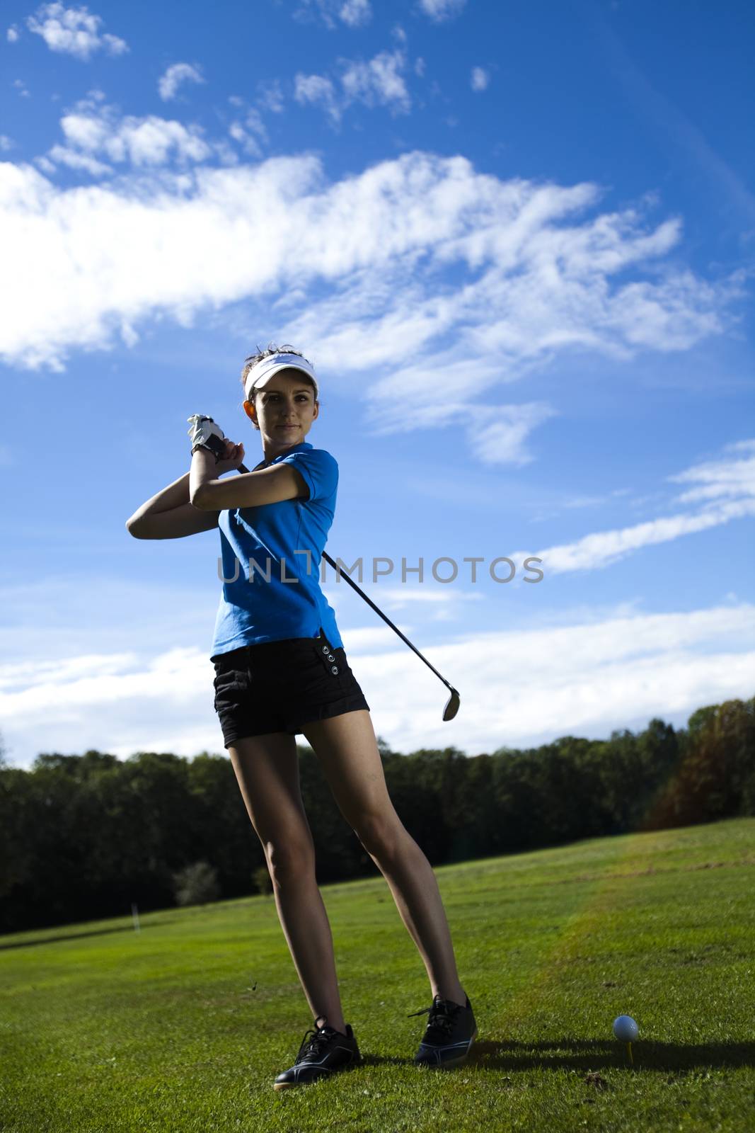 Young woman playing golf, bright colorful vivid theme by JanPietruszka