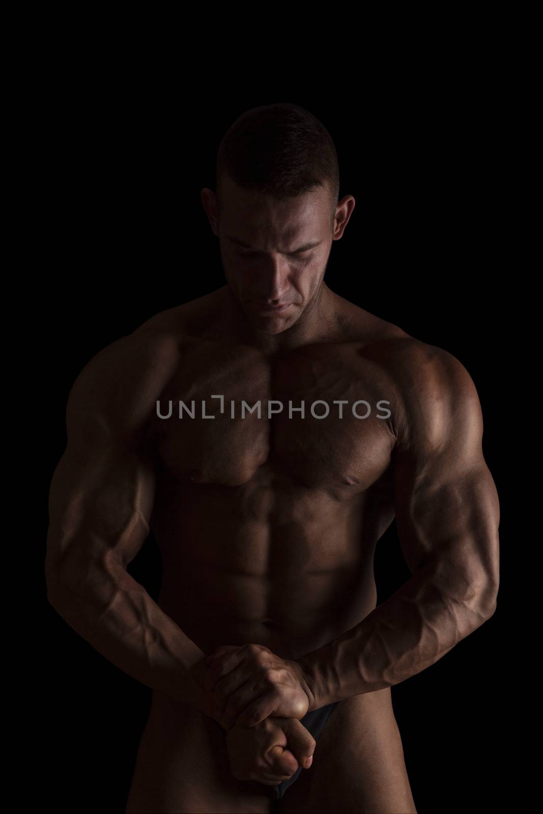 Bodybuilder posing isolated on black.  by eskymaks