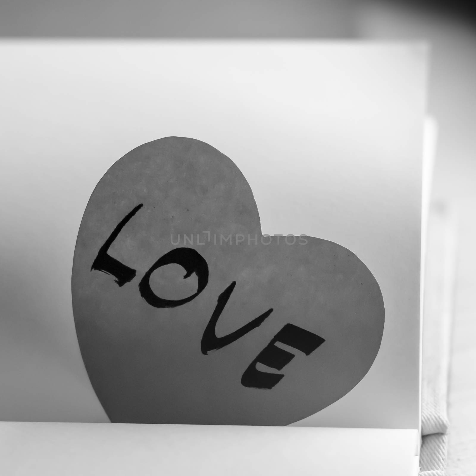 black and white paper heart write love word word