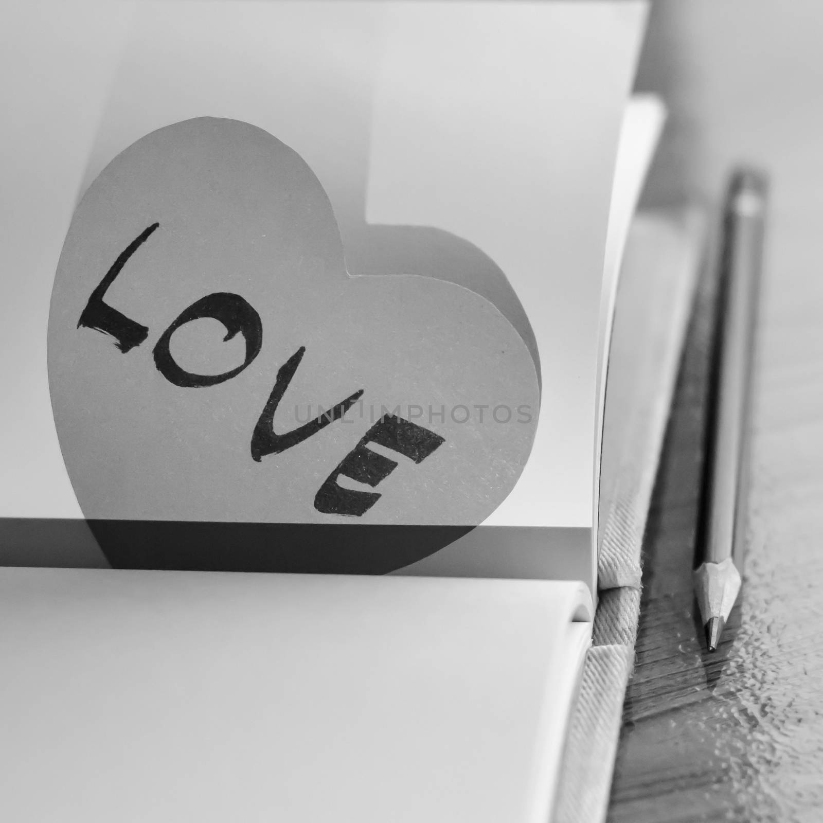 black and white paper heart write love word word