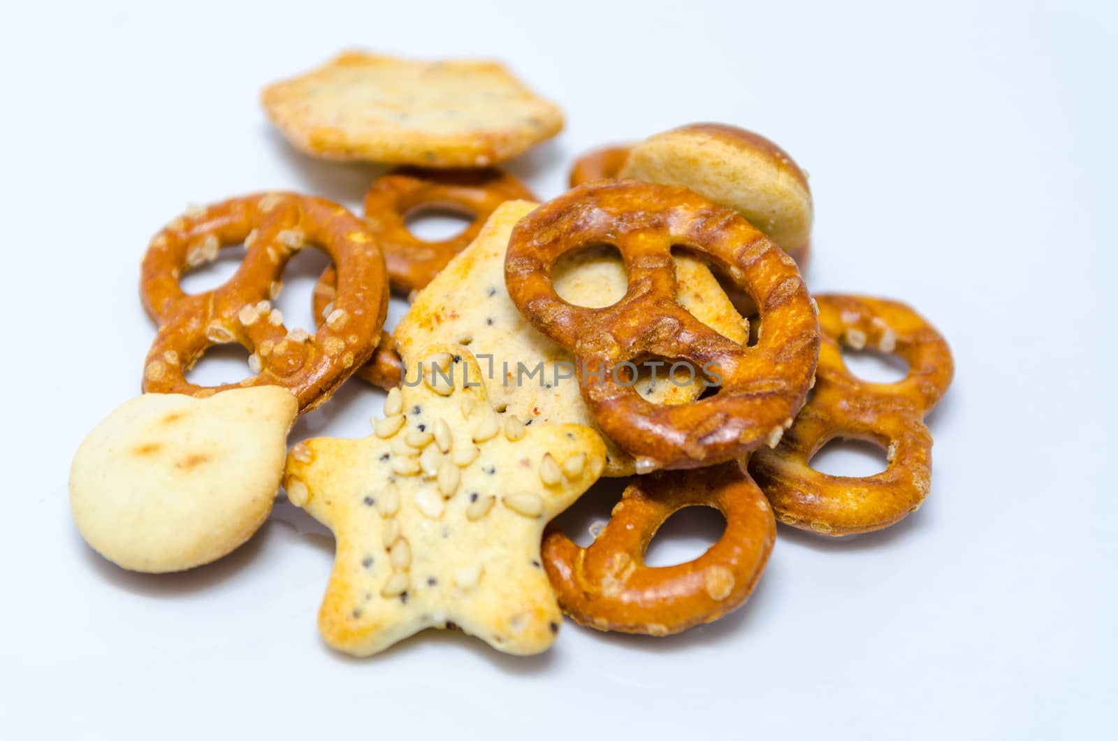 Salt pastries, snacks against white background.