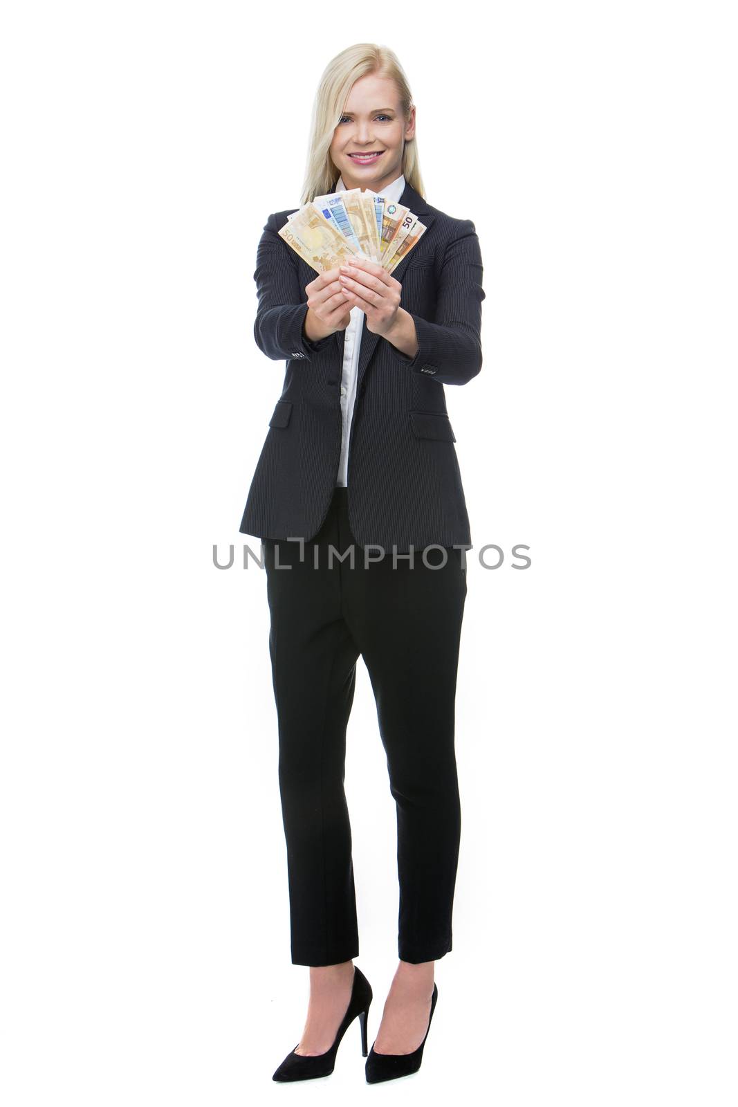businesswoman holding money by Flareimage