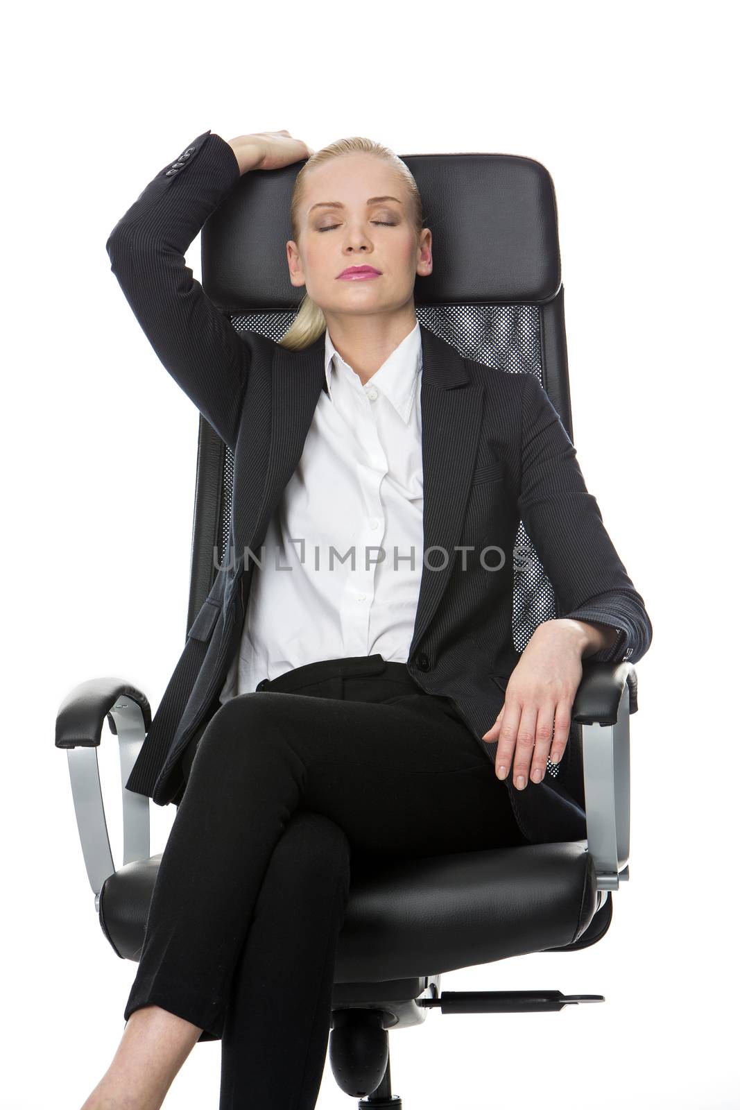 businesswoman with eyes closed by Flareimage