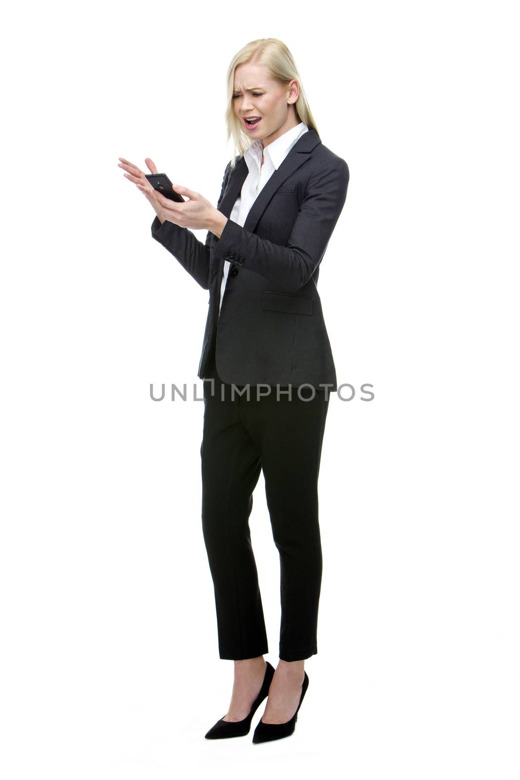 angry blonde businesswoman shouting at mobile phone