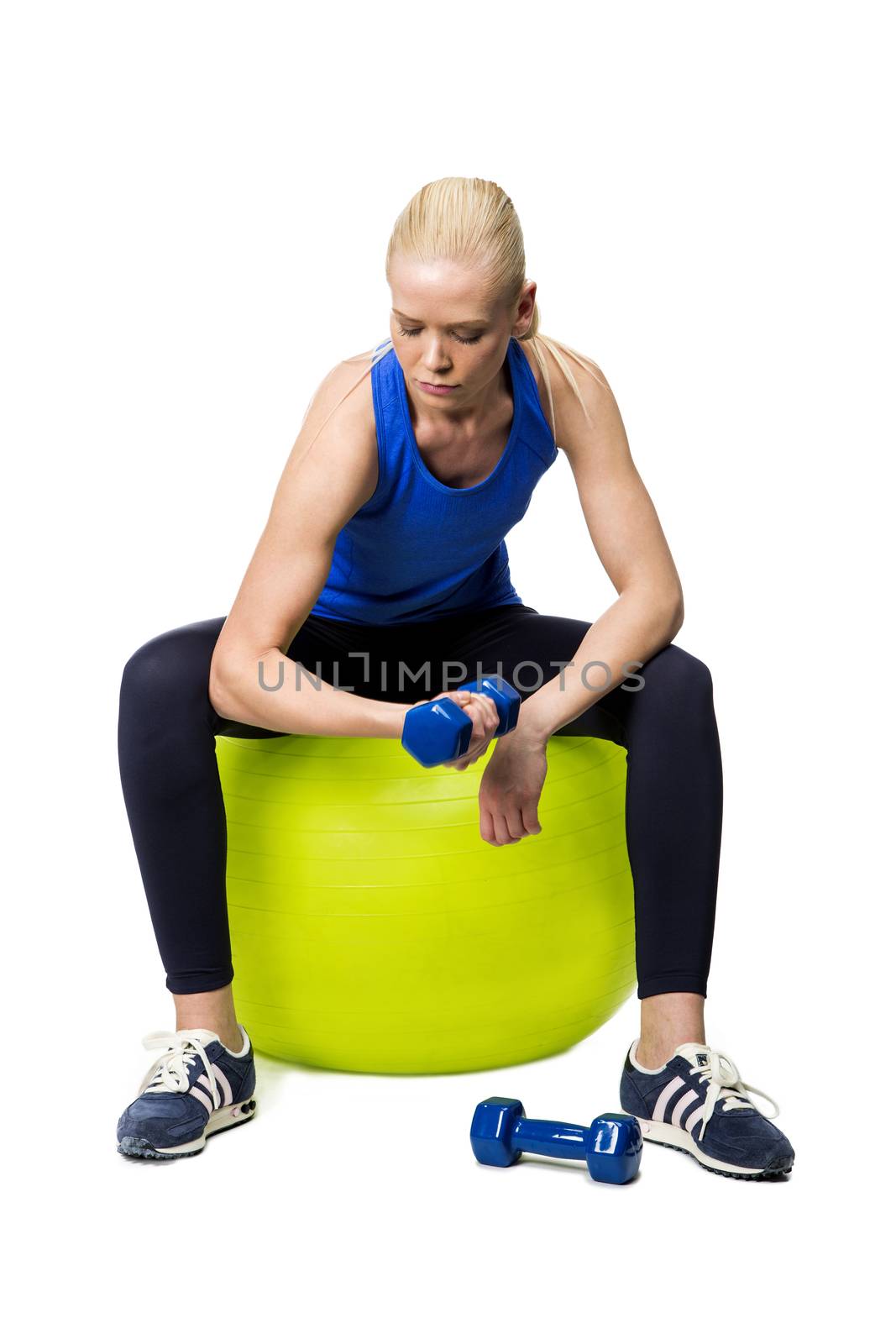 blonde woman exercising by Flareimage