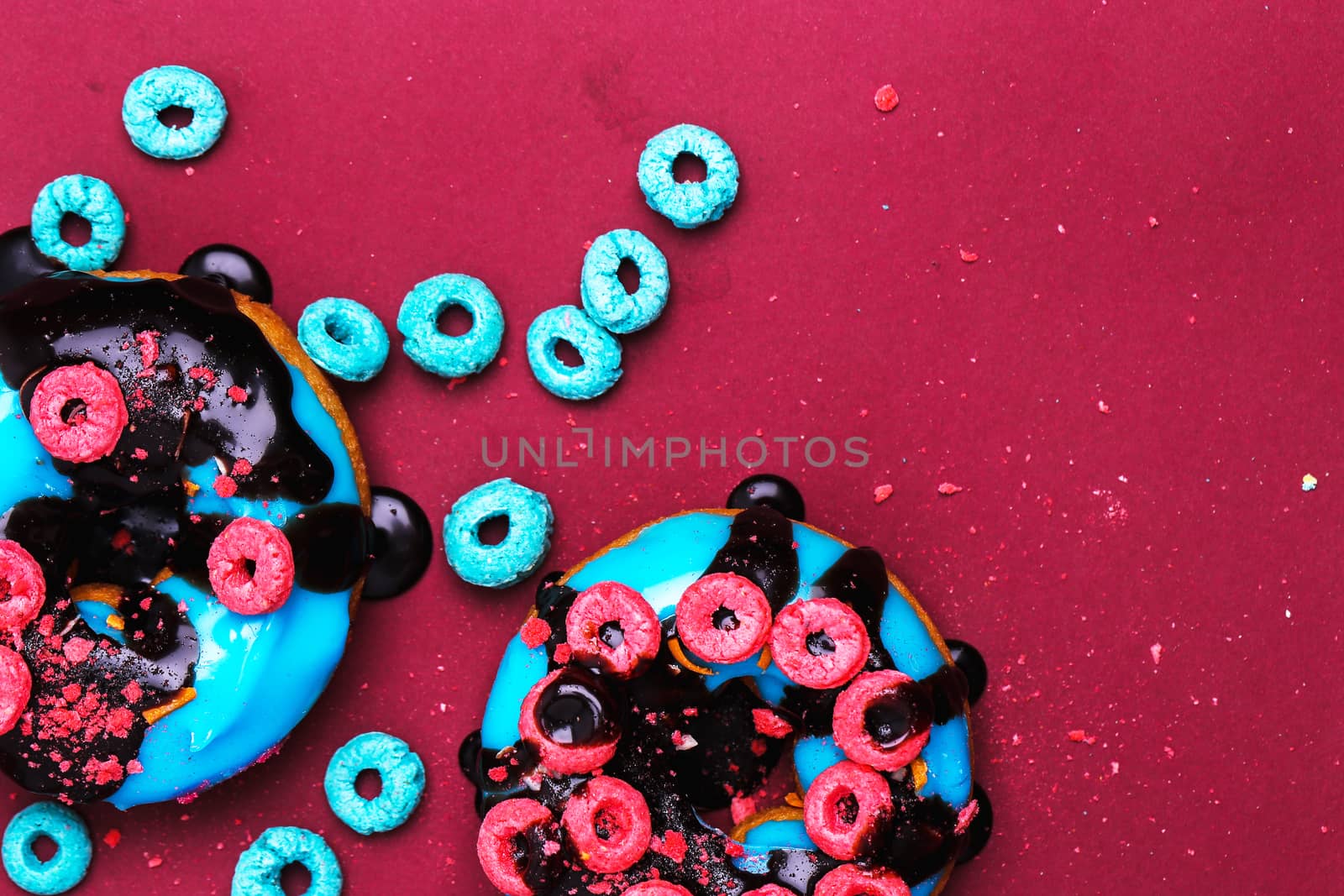 Delicious donuts on a violet background