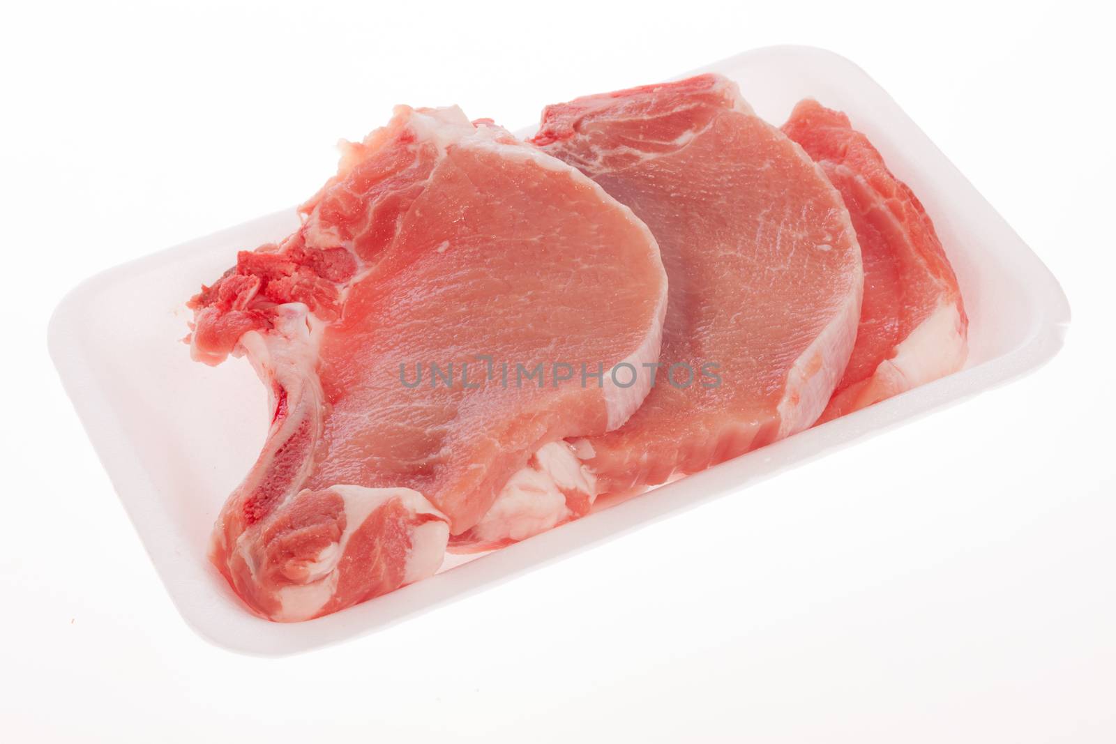 Raw pork chop by aguirre_mar