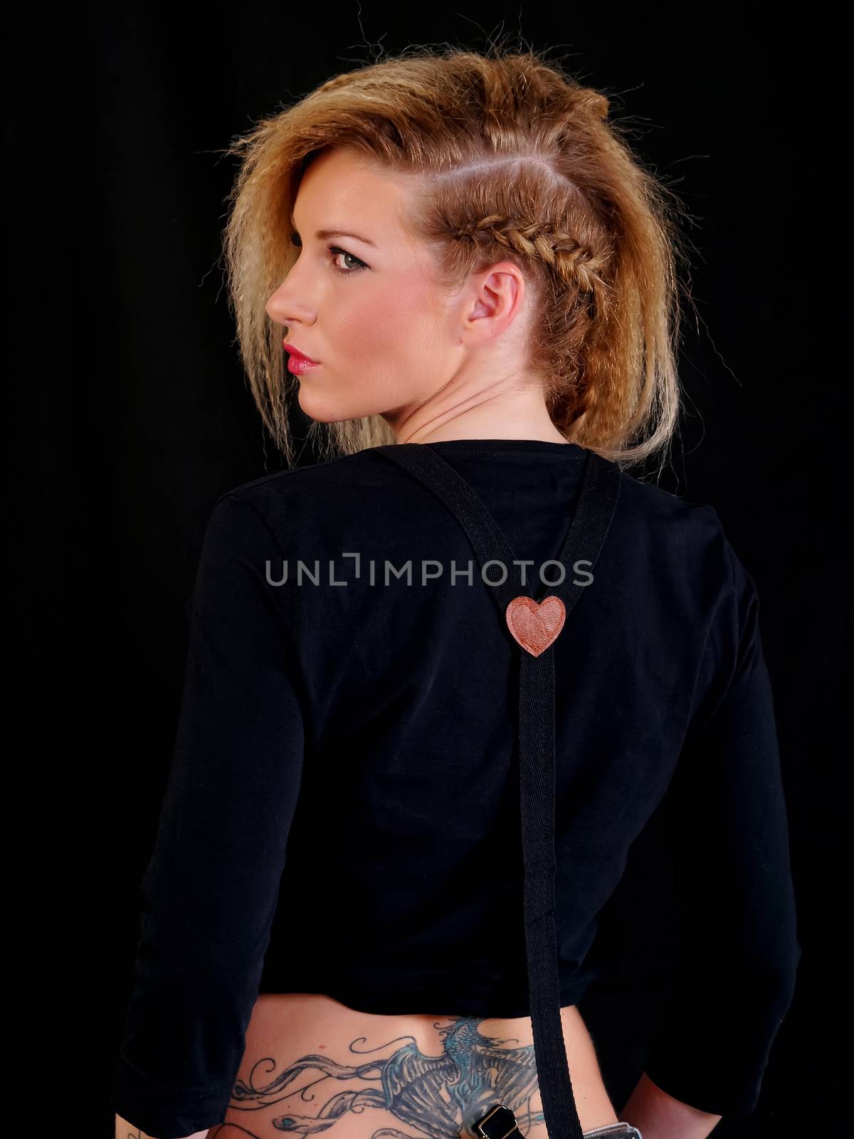 beautiful blonde woman, back side view, studio shot