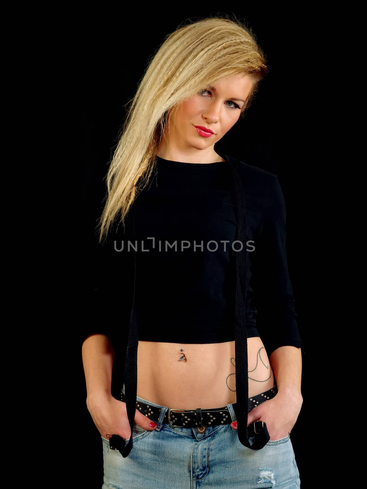 beautiful blonde woman wearing black shirt and jeans, posing