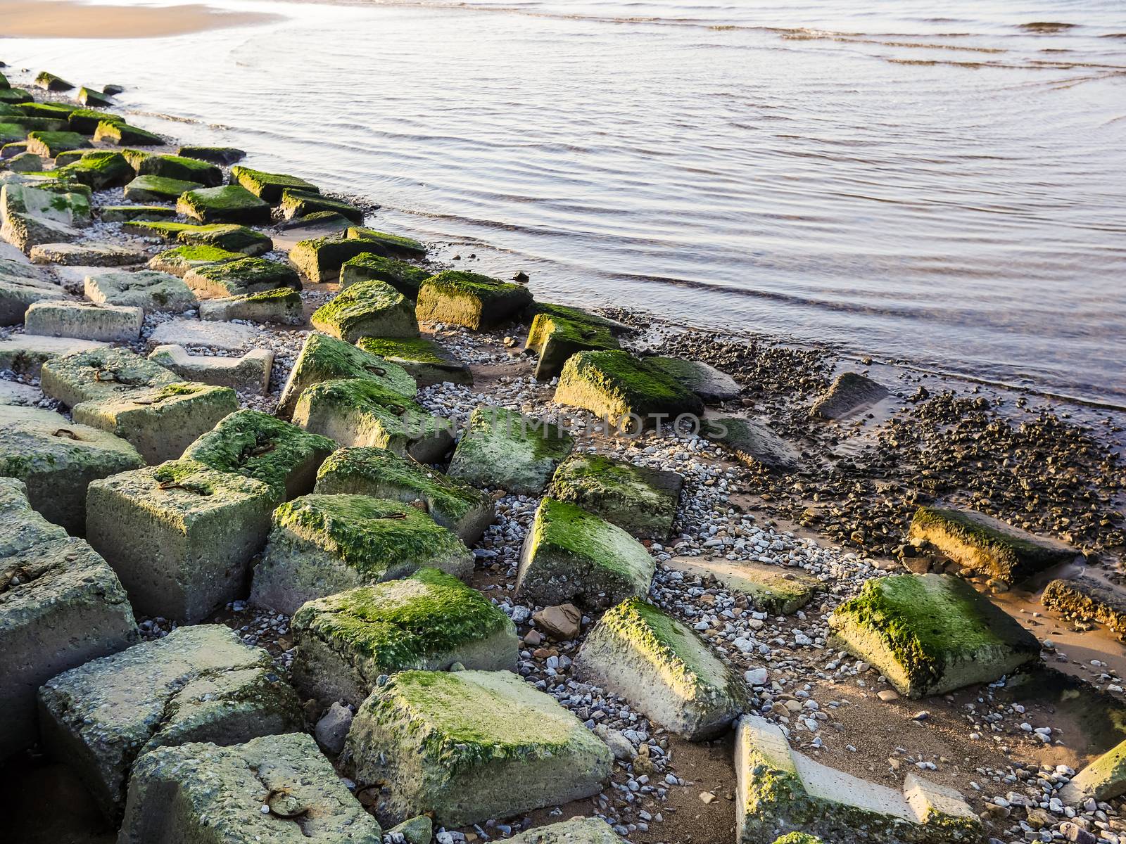 Bech and stone near the ocean by dolfinvik