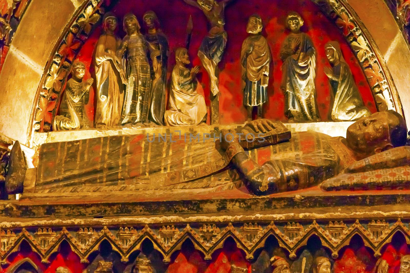 Ancient Tomb of Bishop Statues Old Salamanca Cathedral Castile Spain.  Old Salamanca Cathedral next to the new Salamanca Cathedral is known as Catedral Vieja de Santa Maria.  Founded by Bishop Jerome of Perigold in the 1100s.  It was finished in the 1300s and dedicated to Saint Mary of the See 