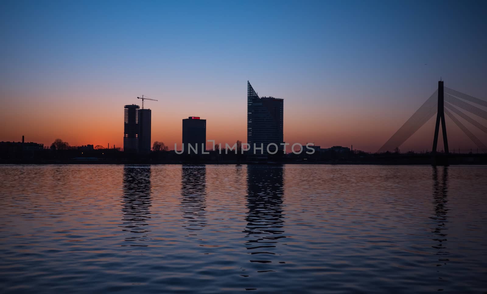 Sunset over the river Daugava in Riga, by dolfinvik