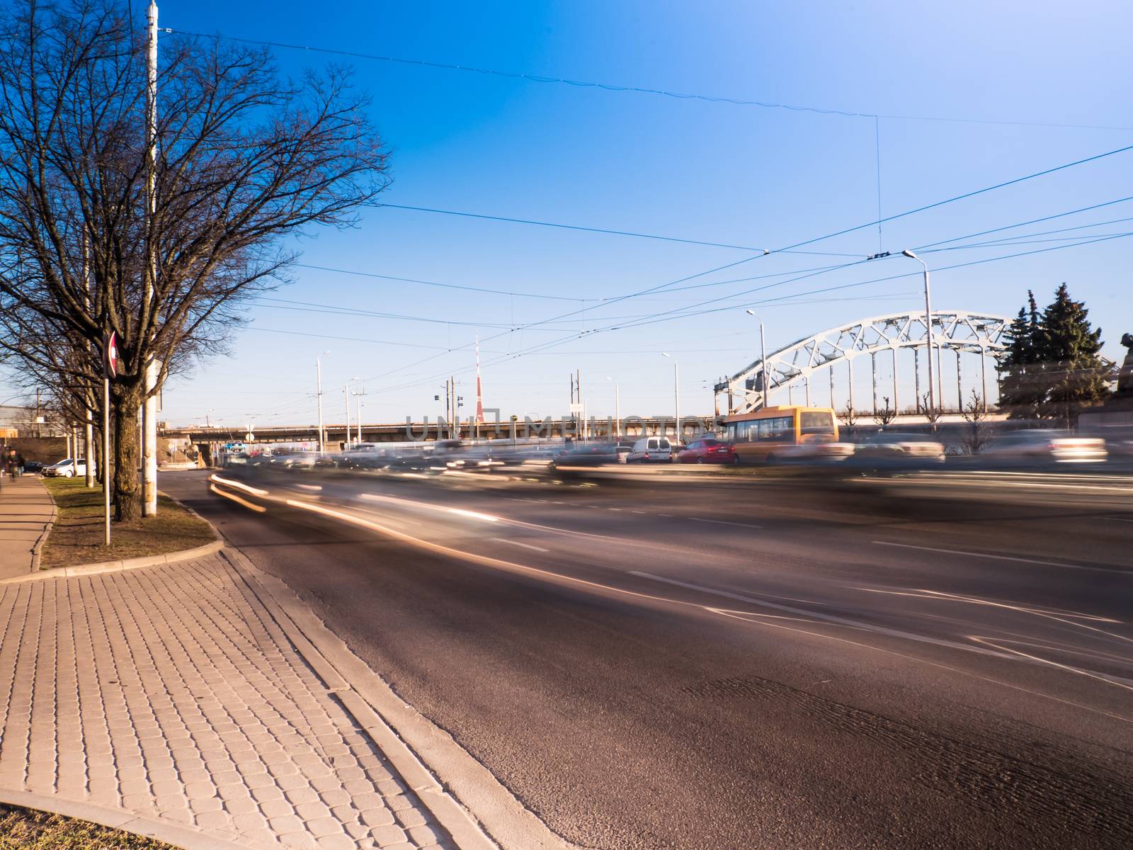 Blured car at day light on a busy city  by dolfinvik