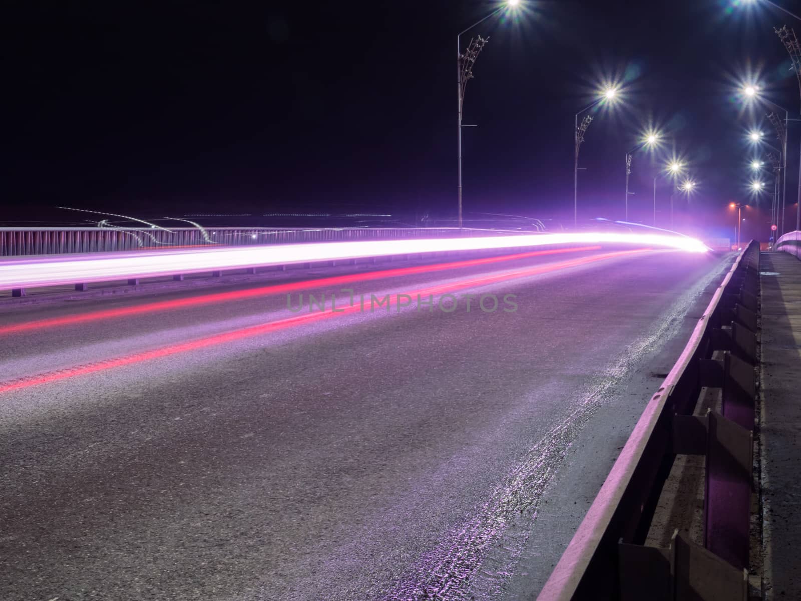 Car Light lines on the road by dolfinvik