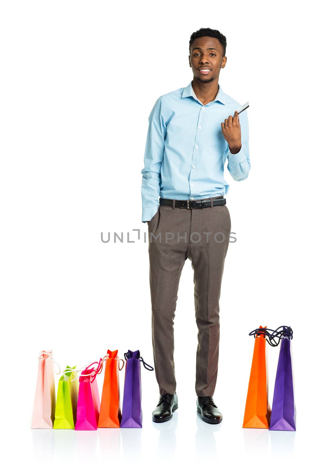 Happy african american man with shopping bags and holding credit by vlad_star