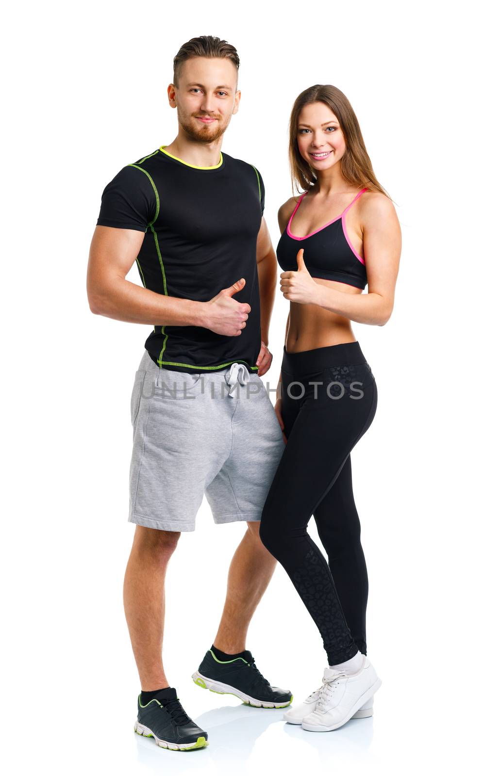 Athletic man and woman after fitness exercise with a finger up o by vlad_star