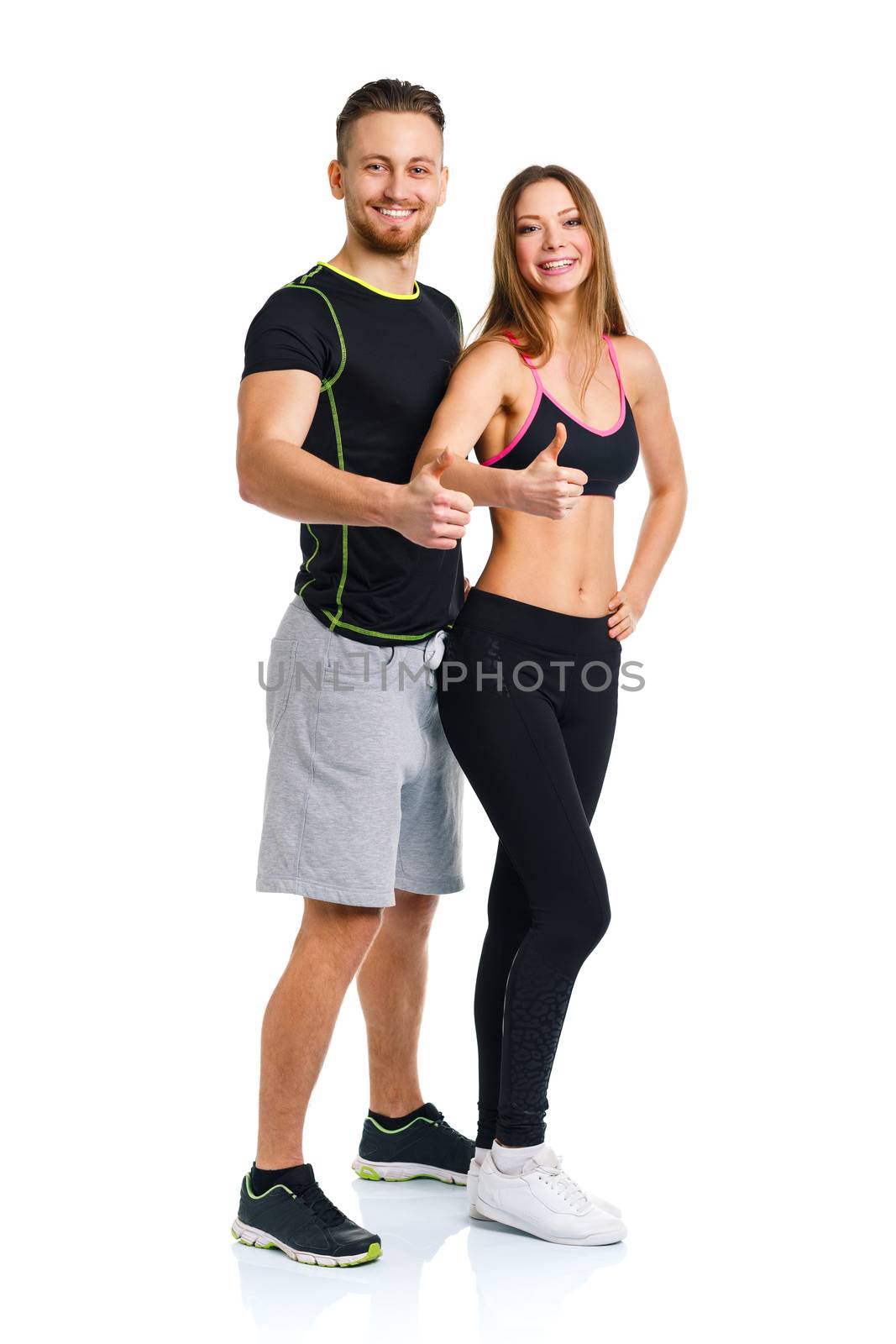 Athletic man and woman after fitness exercise with a finger up on the white background