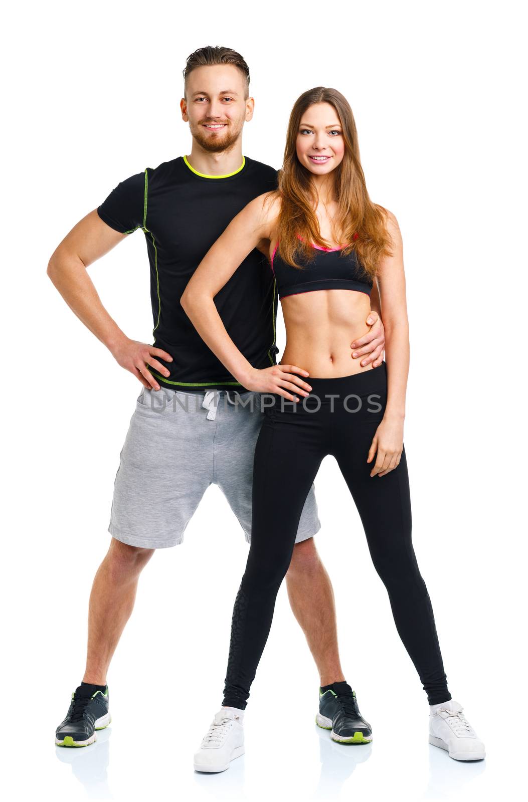 Sport couple - man and woman after fitness exercise on the white background