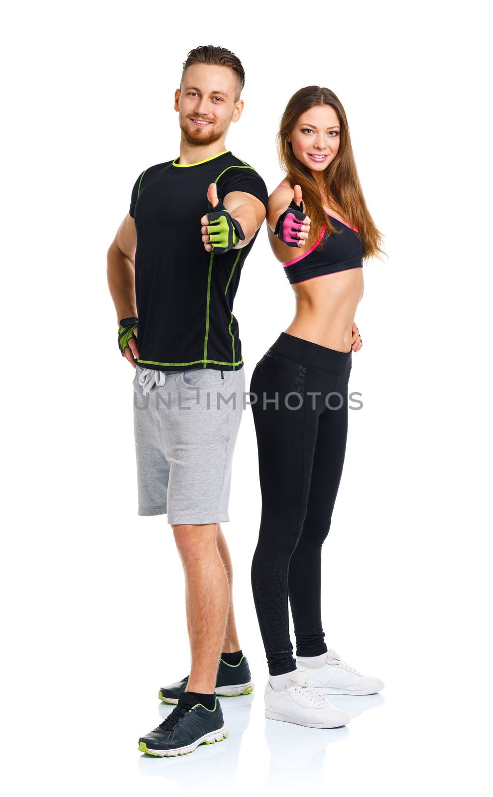 Athletic man and woman after fitness exercise with a finger up o by vlad_star