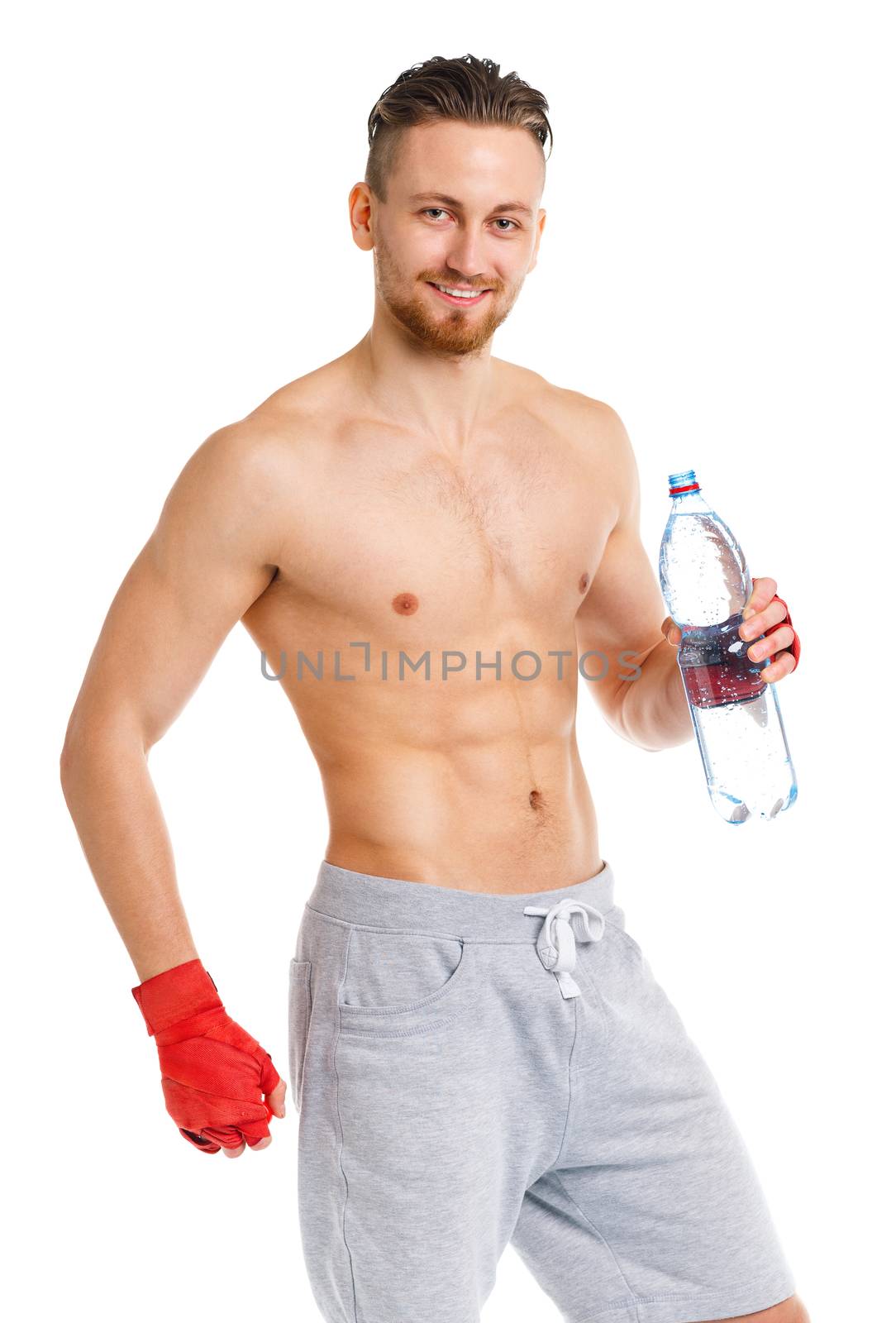 Athletic attractive man wearing boxing bandages with bottle of w by vlad_star