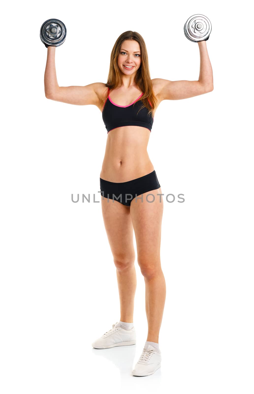 Happy athletic woman with dumbbells doing sport exercise, isolated on white background