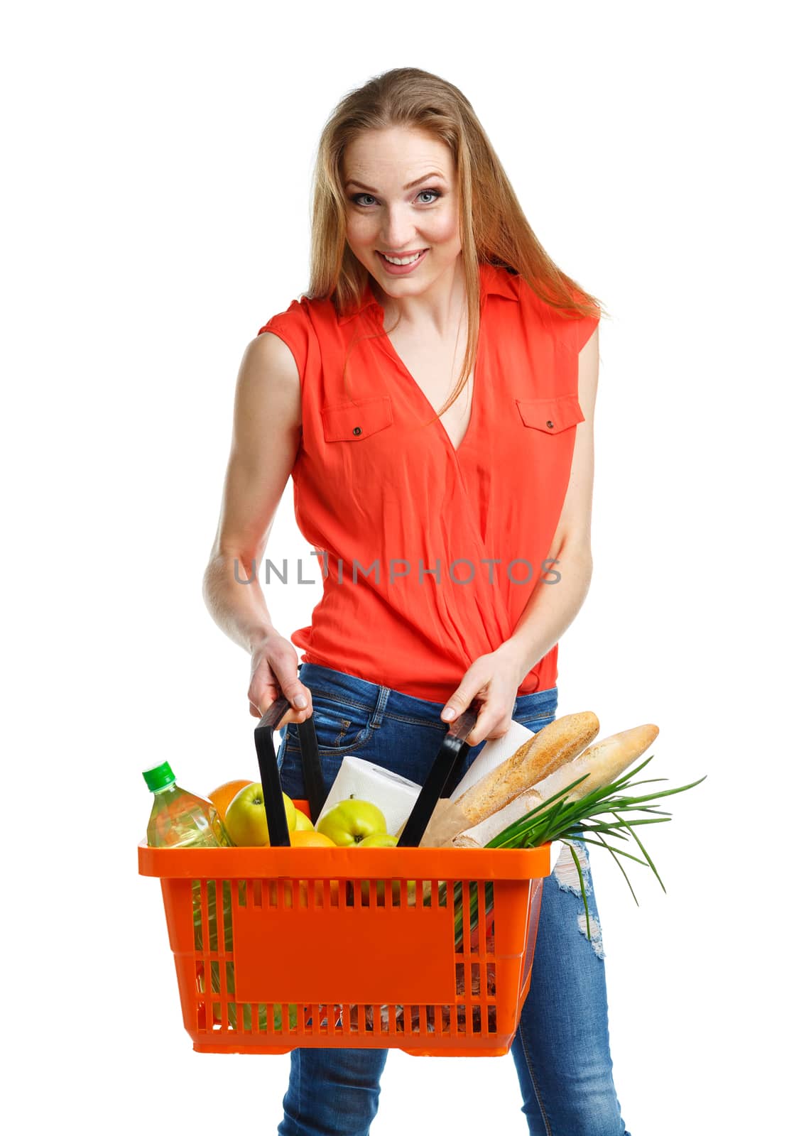 Happy woman holding a basket full of healthy food. Shopping by vlad_star