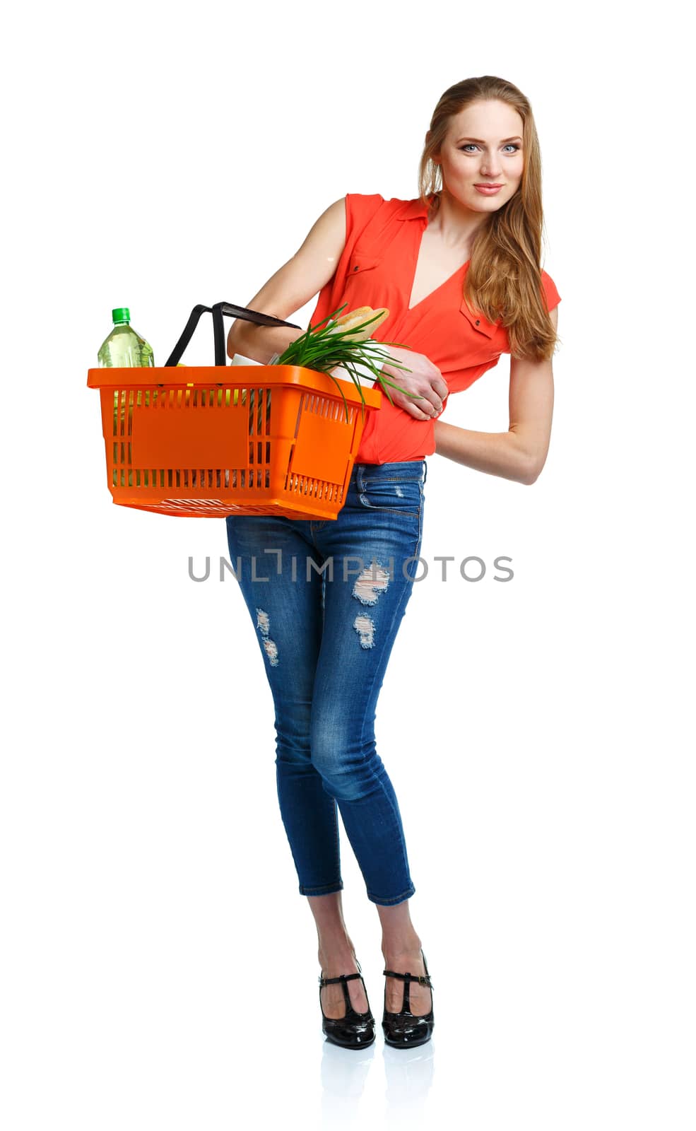 Happy woman holding a basket full of healthy food. Shopping by vlad_star