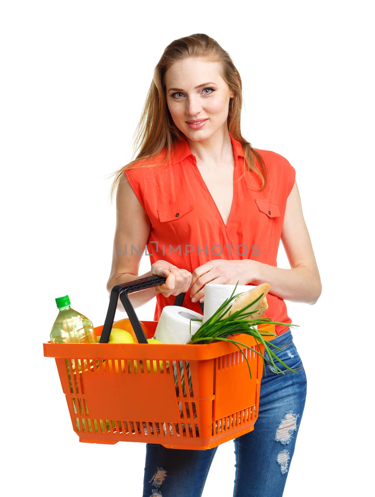 Happy woman holding a basket full of healthy food. Shopping by vlad_star