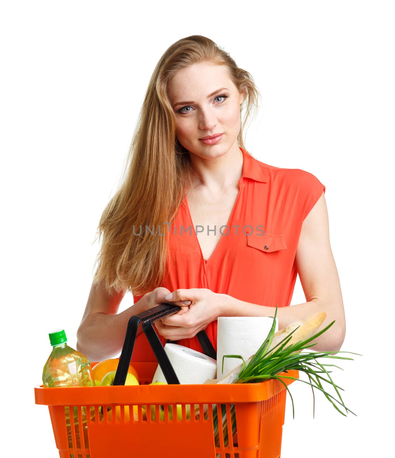 Happy woman holding a basket full of healthy food. Shopping by vlad_star