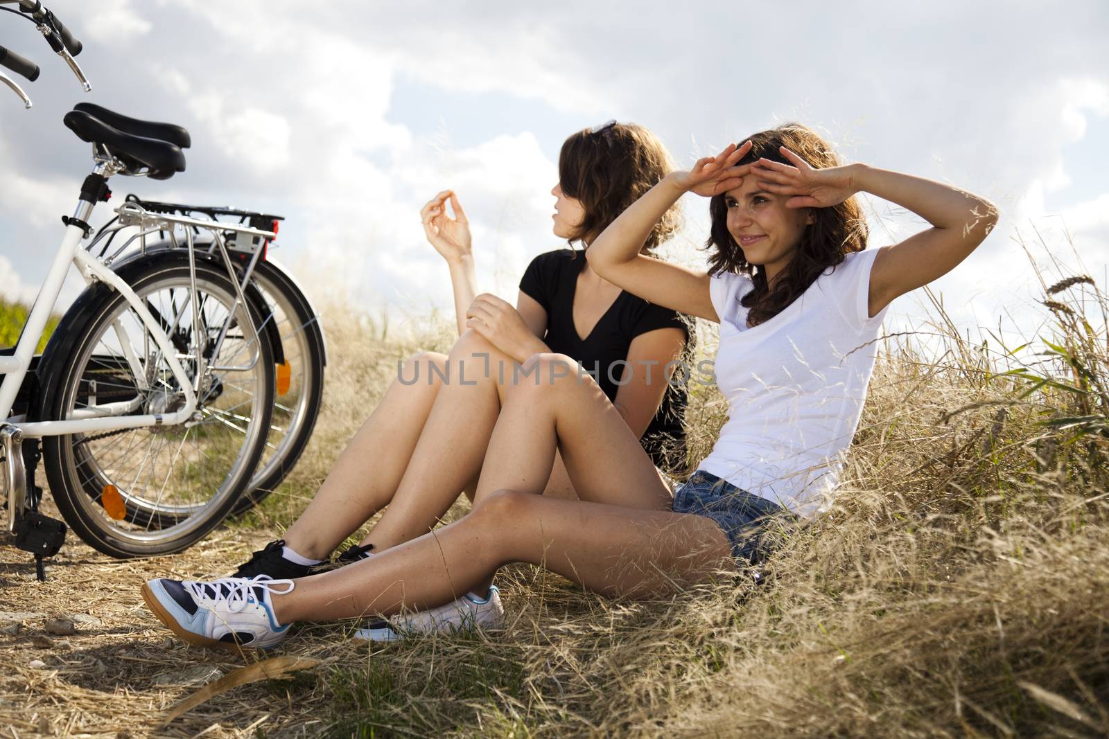 Girl riding her bike, summer free time spending by JanPietruszka