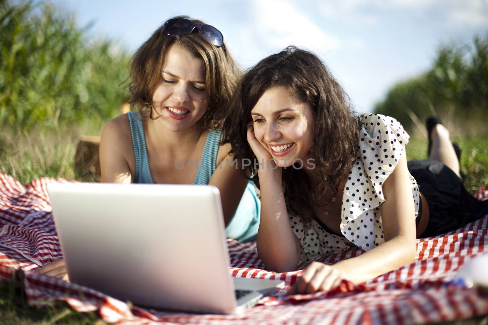 Young women on nature picnic by JanPietruszka