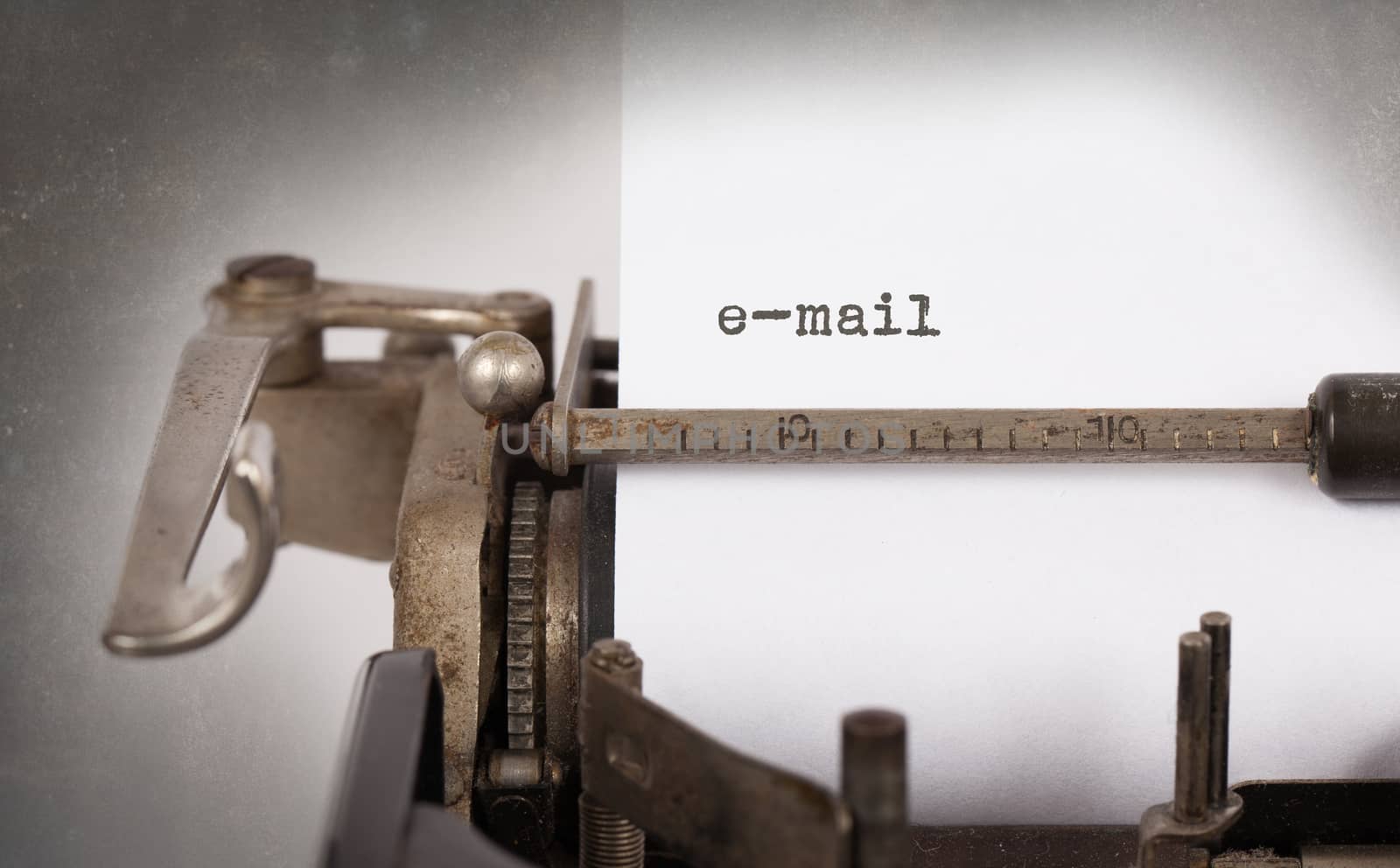 Close-up of an old typewriter with paper, perspective, selective focus, e-mail