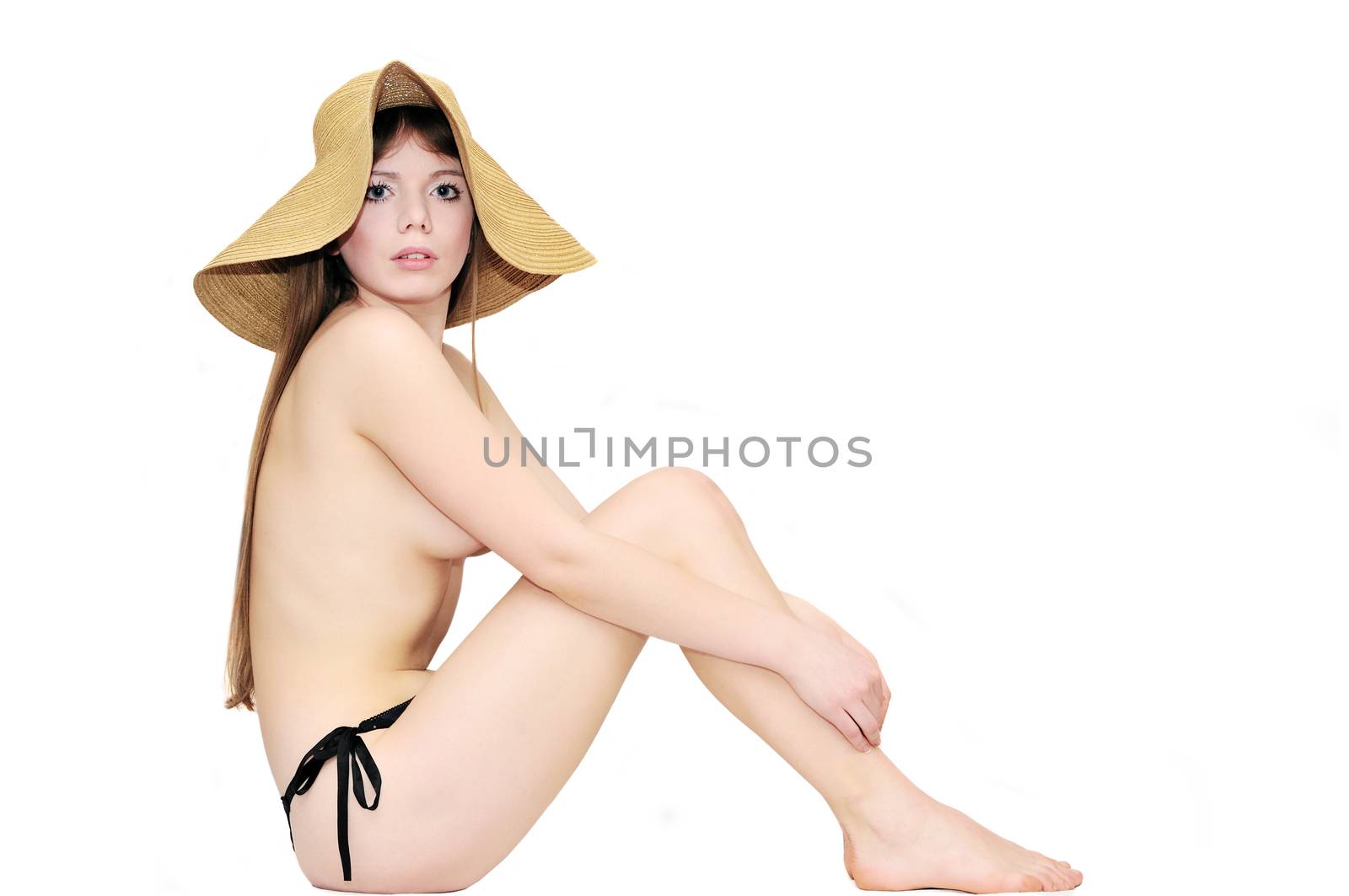 nude girl wearing straw hat on over the white