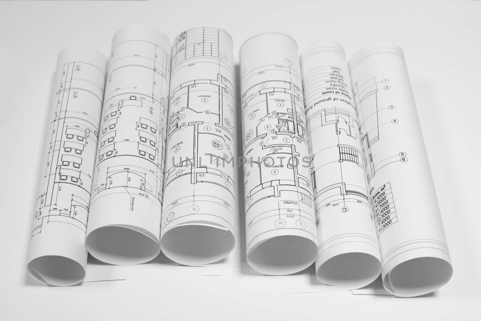 Scrolls architectural drawings on white background. Top view. Concept of building