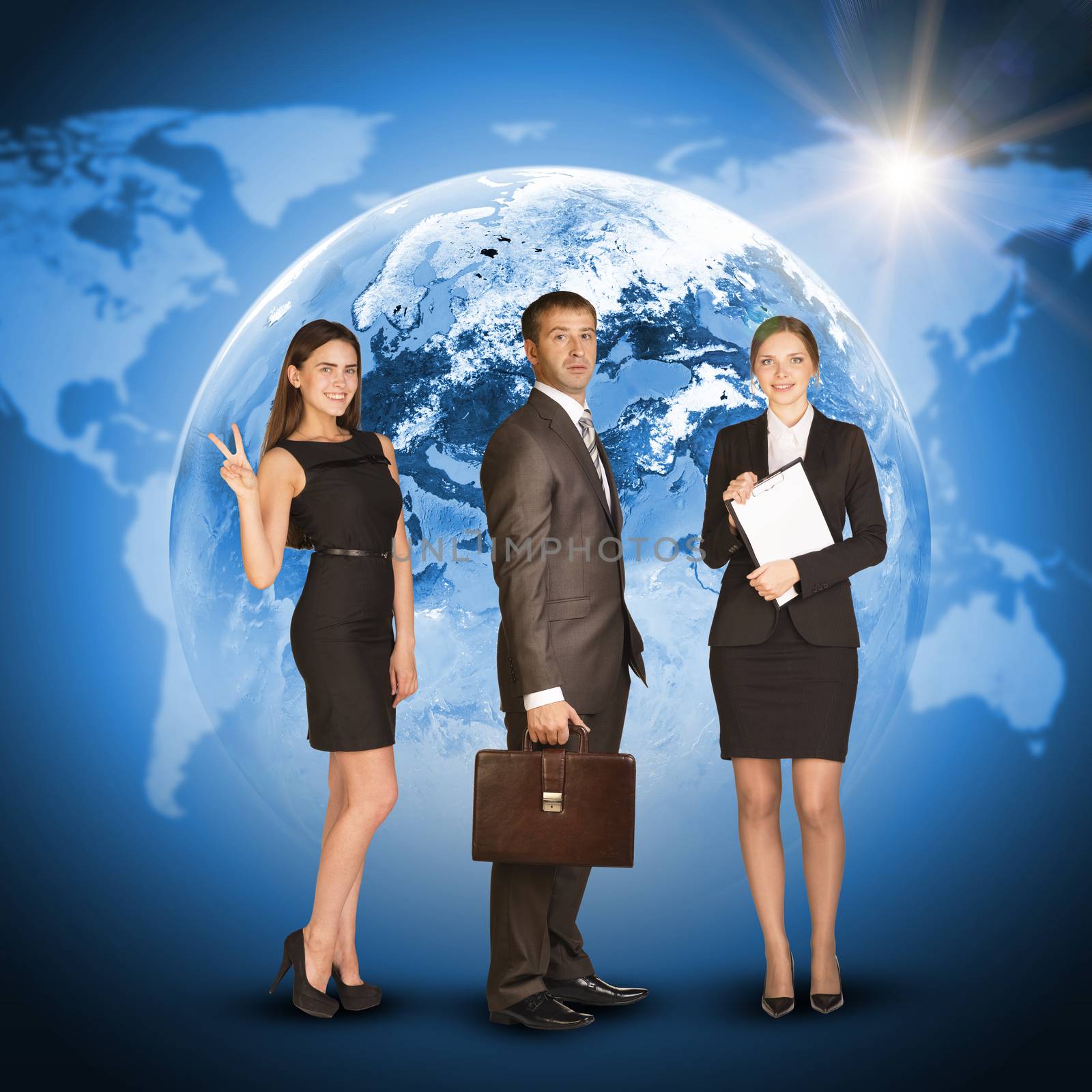 Three business person. Earth with world map and sun as backdrop. Elements of this image furnished by NASA