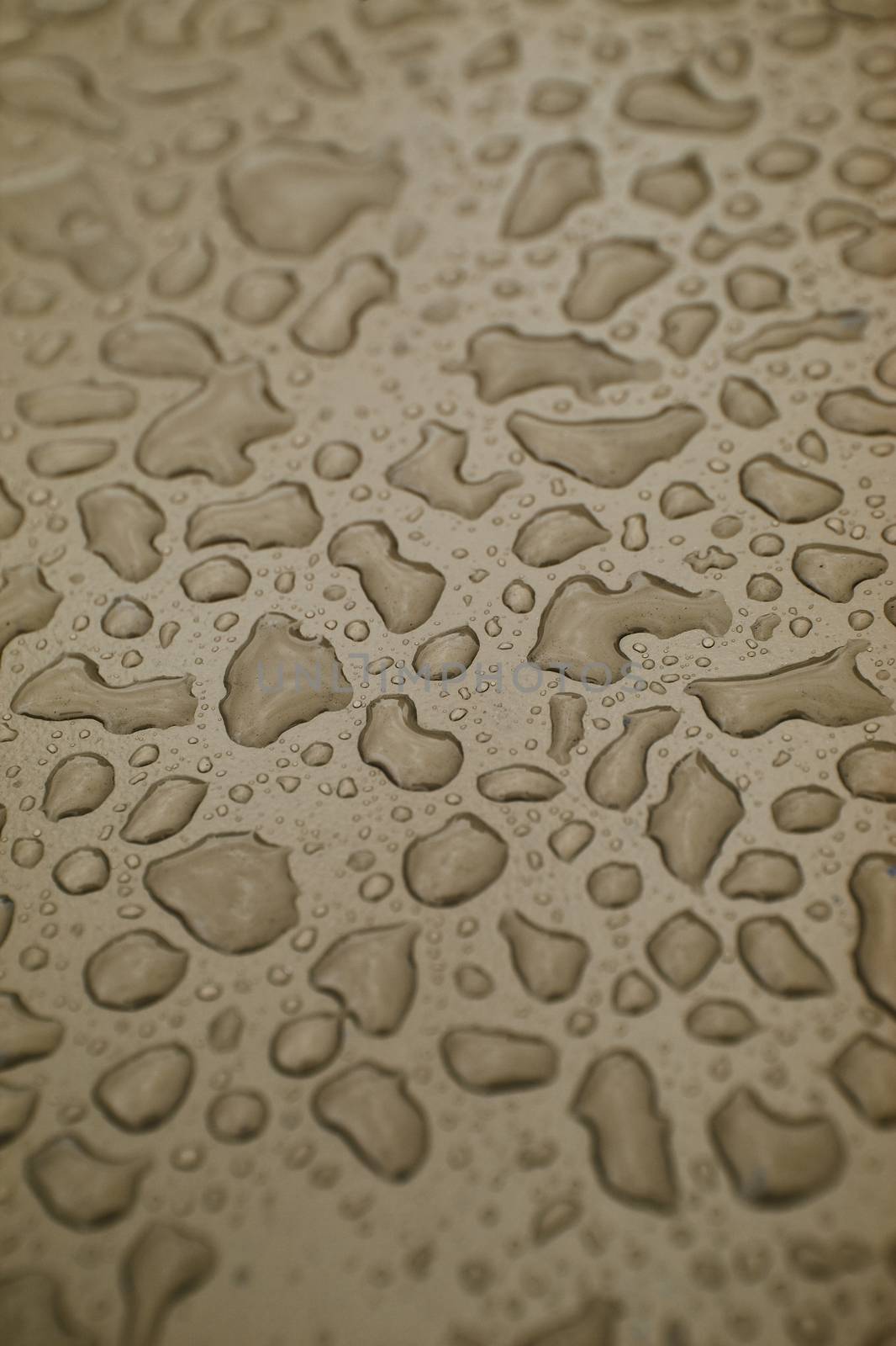 Full Frame of Water Drops on brown background