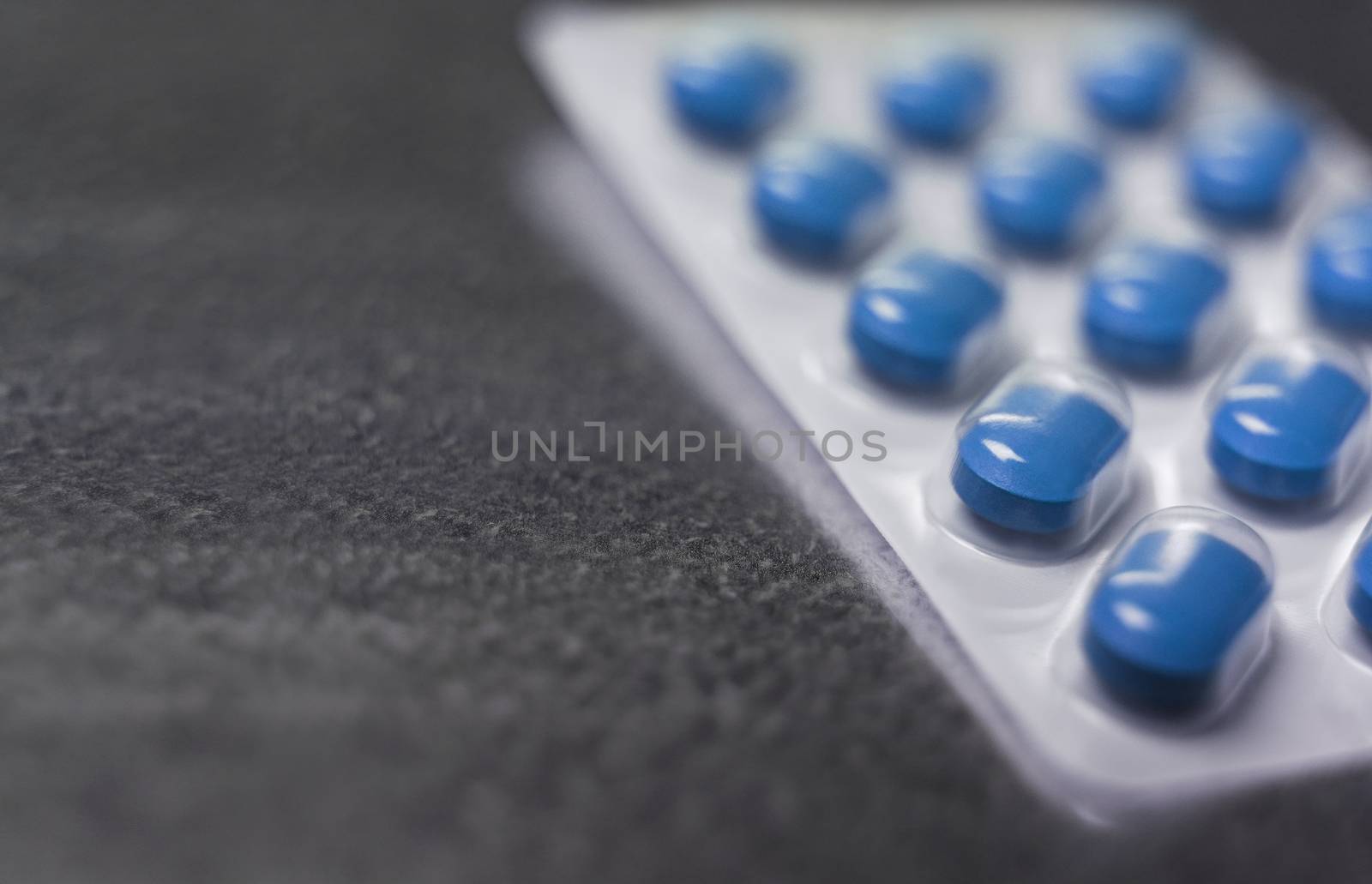 Blister pack of Blue medicine pills Close up by gemenacom