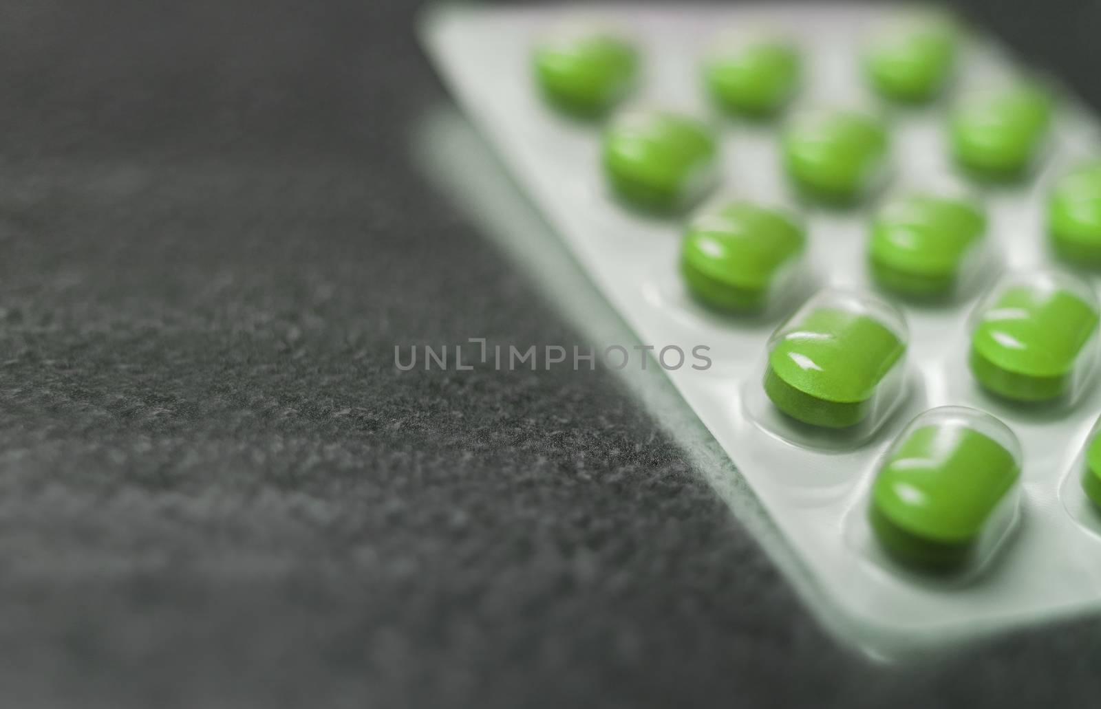Blister pack of Green medicine pills Close up by gemenacom