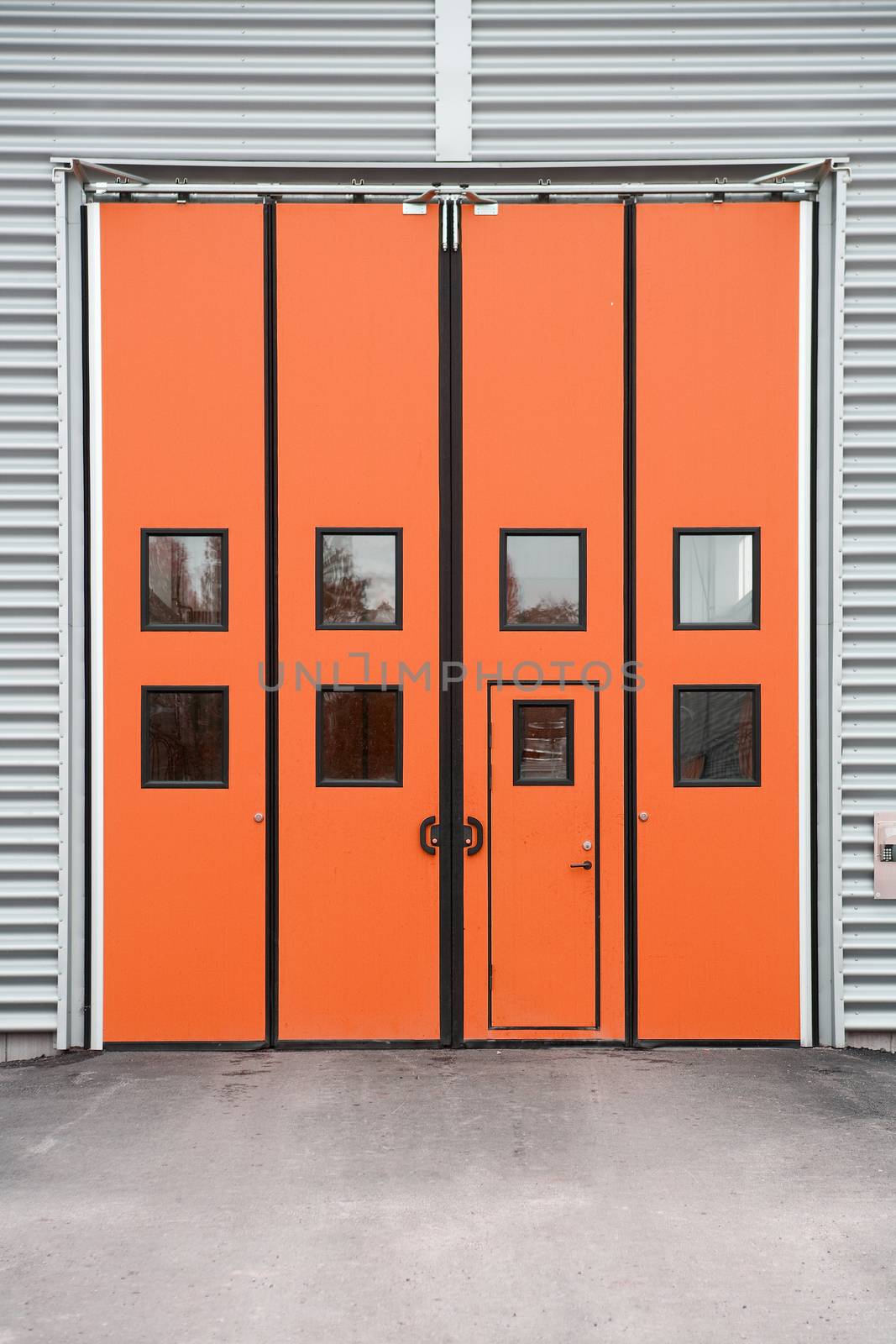 Orange Garage Door on a warehouse building