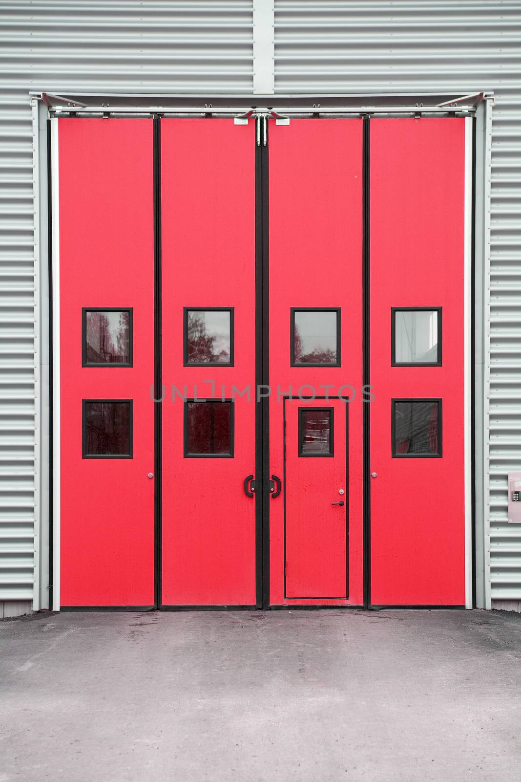 Red Garage Door on a warehouse building by gemenacom