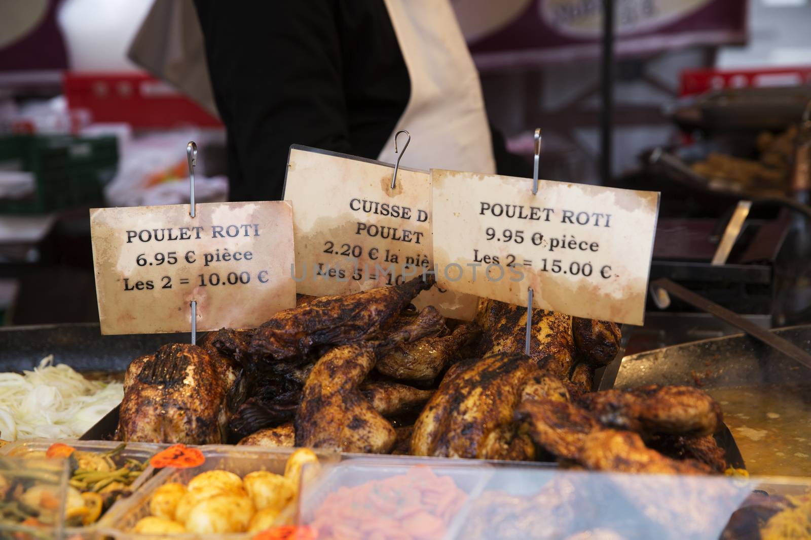 Grilled Chickens at the Market in Paris at spring