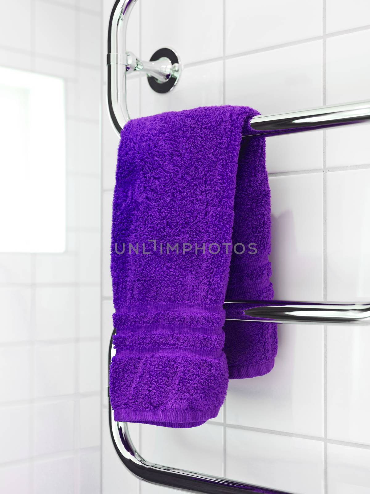 Purple Towel on a dryer in modern bathroom environment