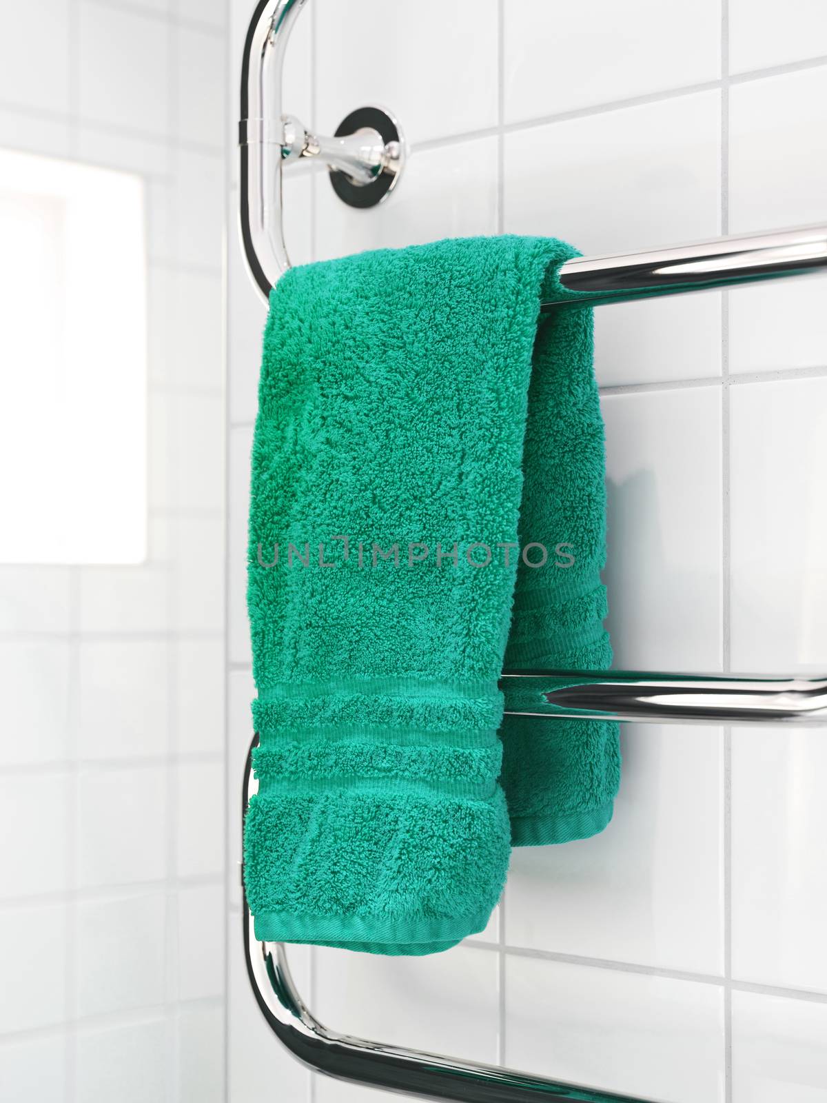 Green towel on a dryer by gemenacom