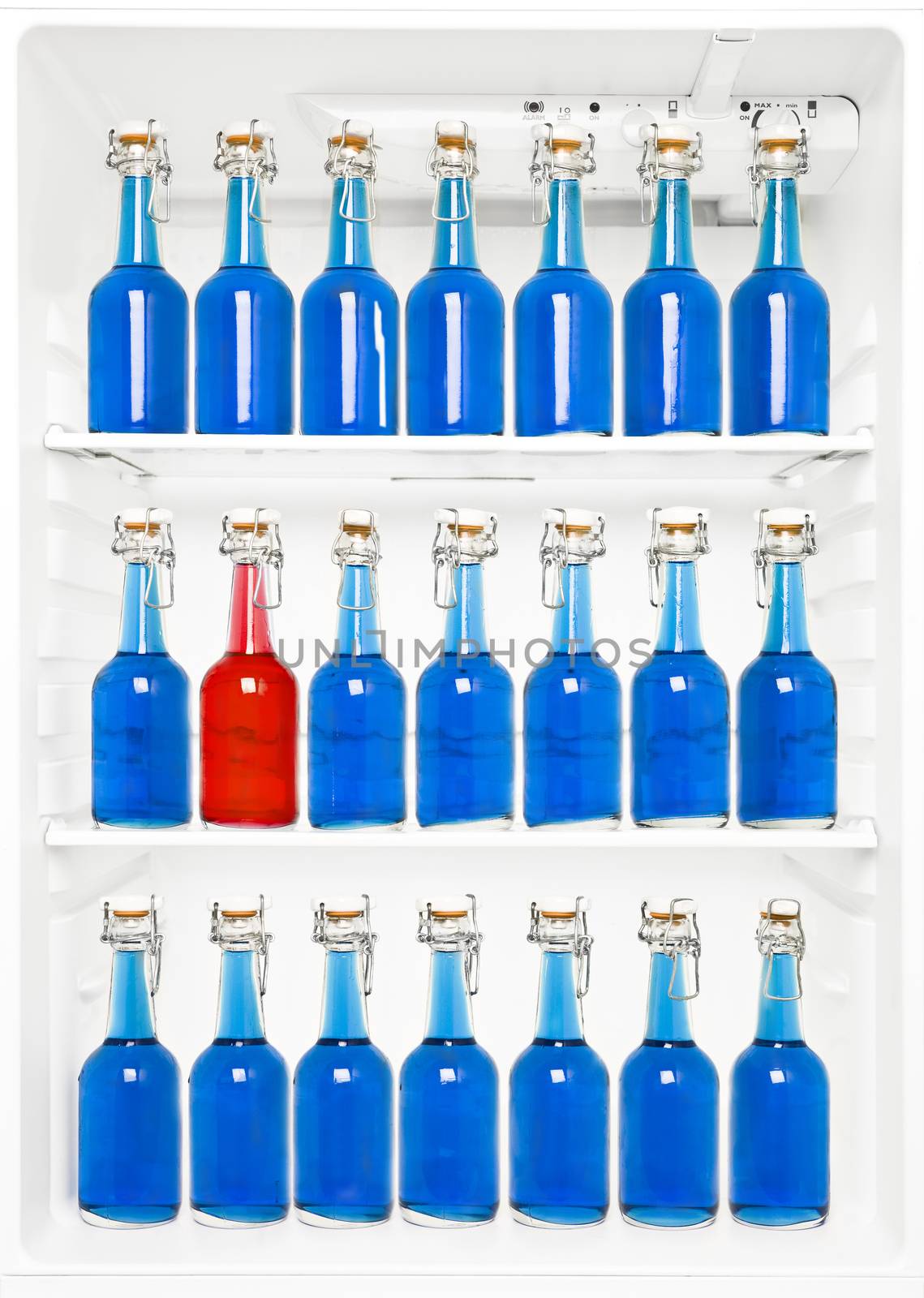 One Red Bottle among a large group of blue bottles in a fridge