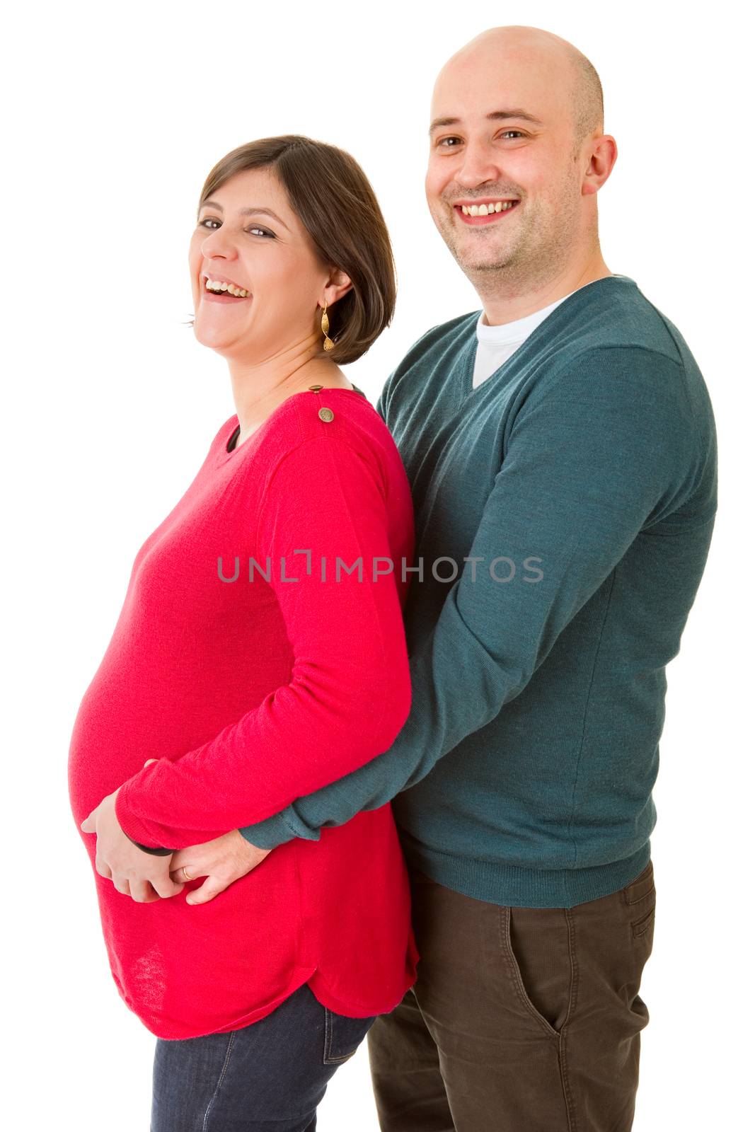 happy pregnant couple posing on white background