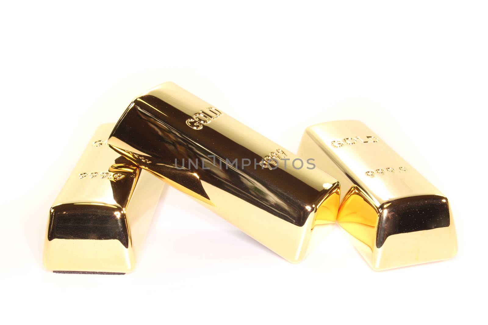 three stacked gold bars on a light background